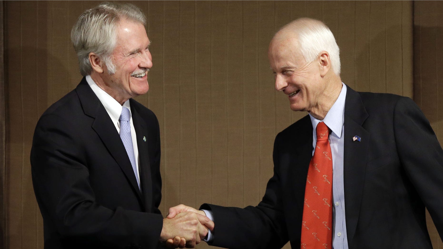 Oct. 10, 2014: Oregon Democratic Gov. John Kitzhaber, left, shakes hands with Republican challenger Dennis Richardson.