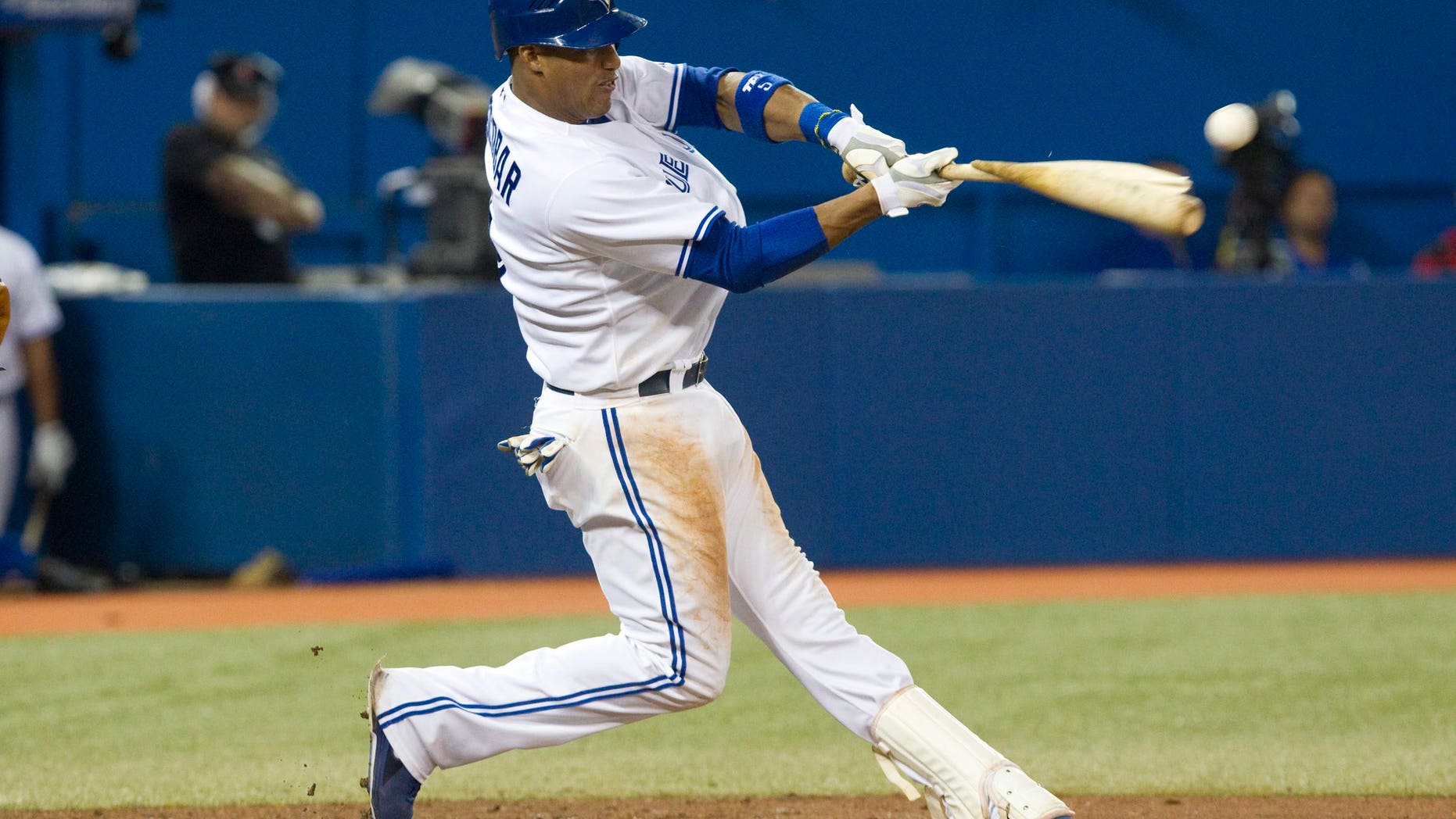Sept. 5, 2012: Toronto Blue Jays' Yunel Escobar breaks his bat as he hits a double off a ball from Baltimore Orioles pitcher Miguel Gonzalez during the seventh inning of baseball game action in Toronto.