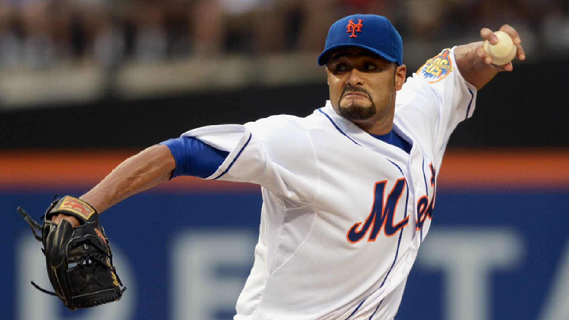 FILE - In this file photo taken Aug. 11, 2012, New York Mets' Johan Santana pitches in baseball game in New York. The two-time AL Cy Young Award winner has agreed to a minor league contract with the Baltimore Orioles, in a deal announced Tuesday, March 4, 2014, as he tries to come back from the second major operation on his left shoulder. (AP Photos/Henny Ray Abrams, file)
