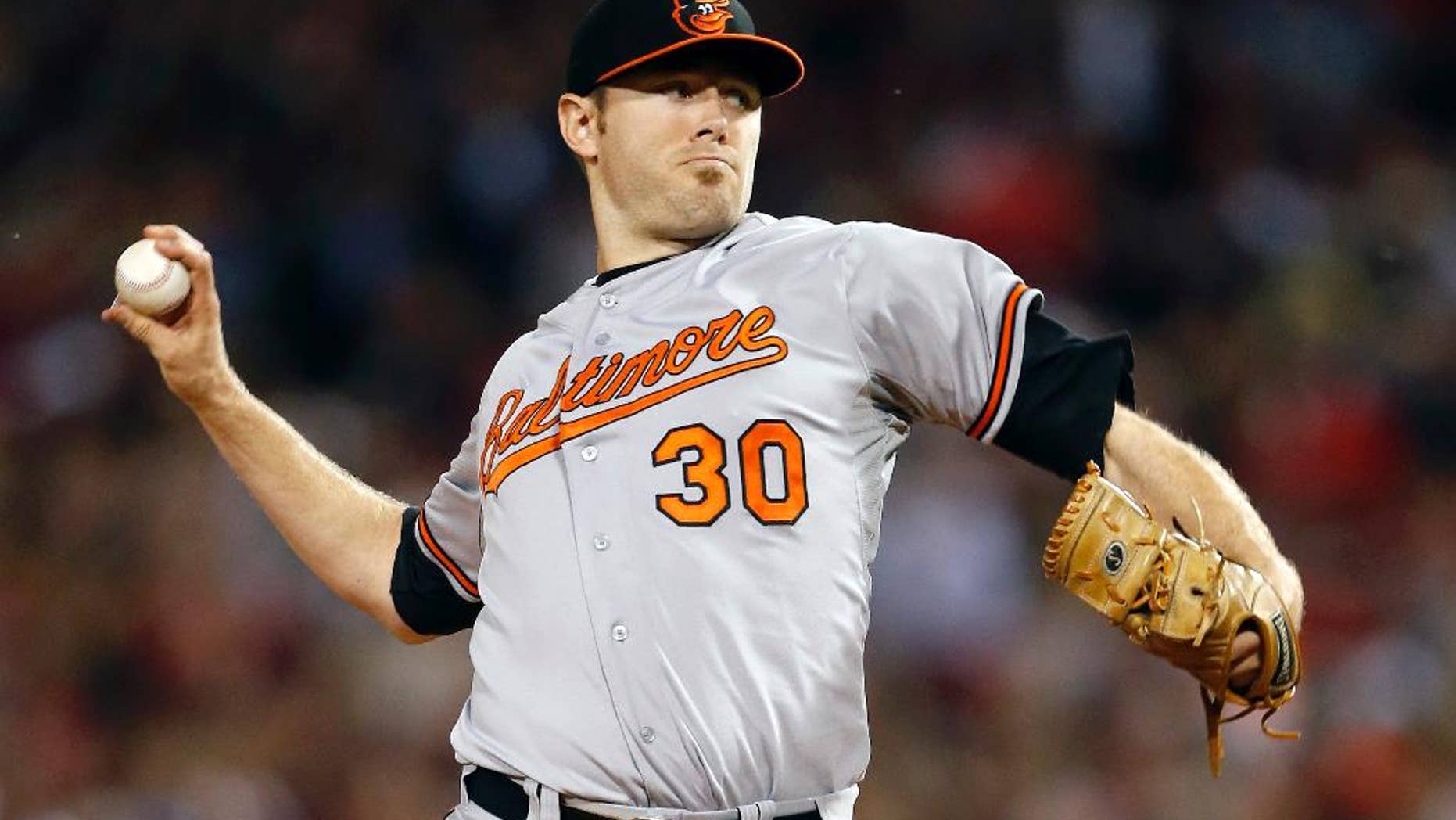 FILE - In this Sept. 19, 2013 file photo, Baltimore Orioles' Chris Tillman pitches in the first inning of a baseball game against the Boston Red Sox in Boston. Tillman finally put it all together last season, doubling his win total during a 16-7 year that probably earned him his first opening day start. (AP Photo/Michael Dwyer, File)
