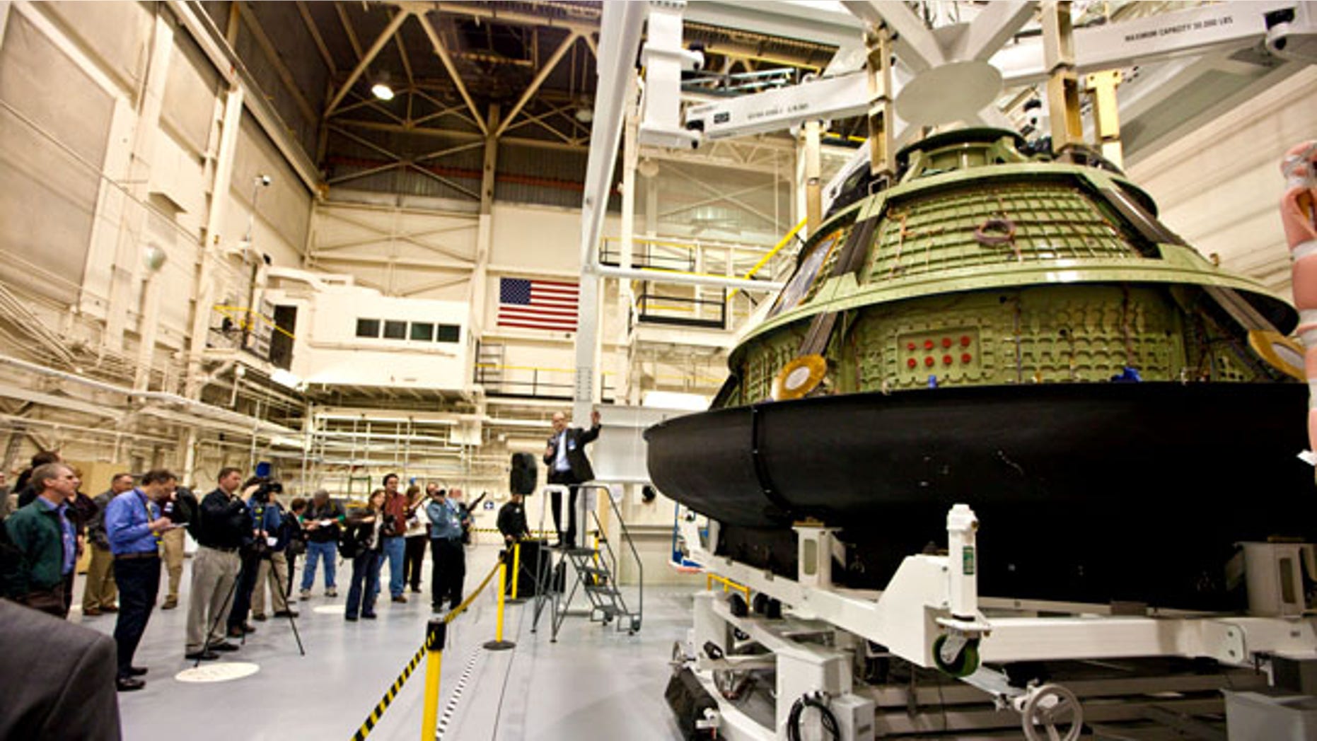 Jim Bray, Orion Crew and Service Module Director, explains how the Orion crew module will be integrated with the backshell and heat shield structure prior to acoustic and vibration testing. The spacecraft is being prepared to undergo rigorous acoustic and vibration testing to validate Orions ability to endure the harsh environments of deep space.