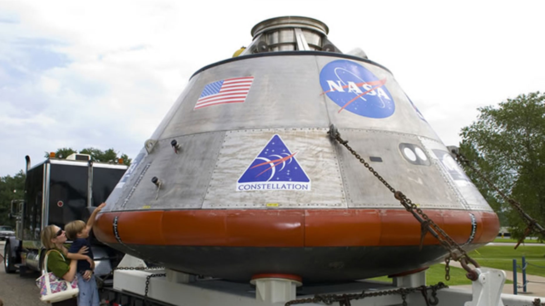 Visitors view a full-scale mockup of NASA's Orion crew exploration vehicle during its one-day display August 12 at StenniSphere, the visitor center at John C. Stennis Space Center. President Obama will announce plans to salvage the Orion module from the overbudget Constellation program in a speech Thursday.
