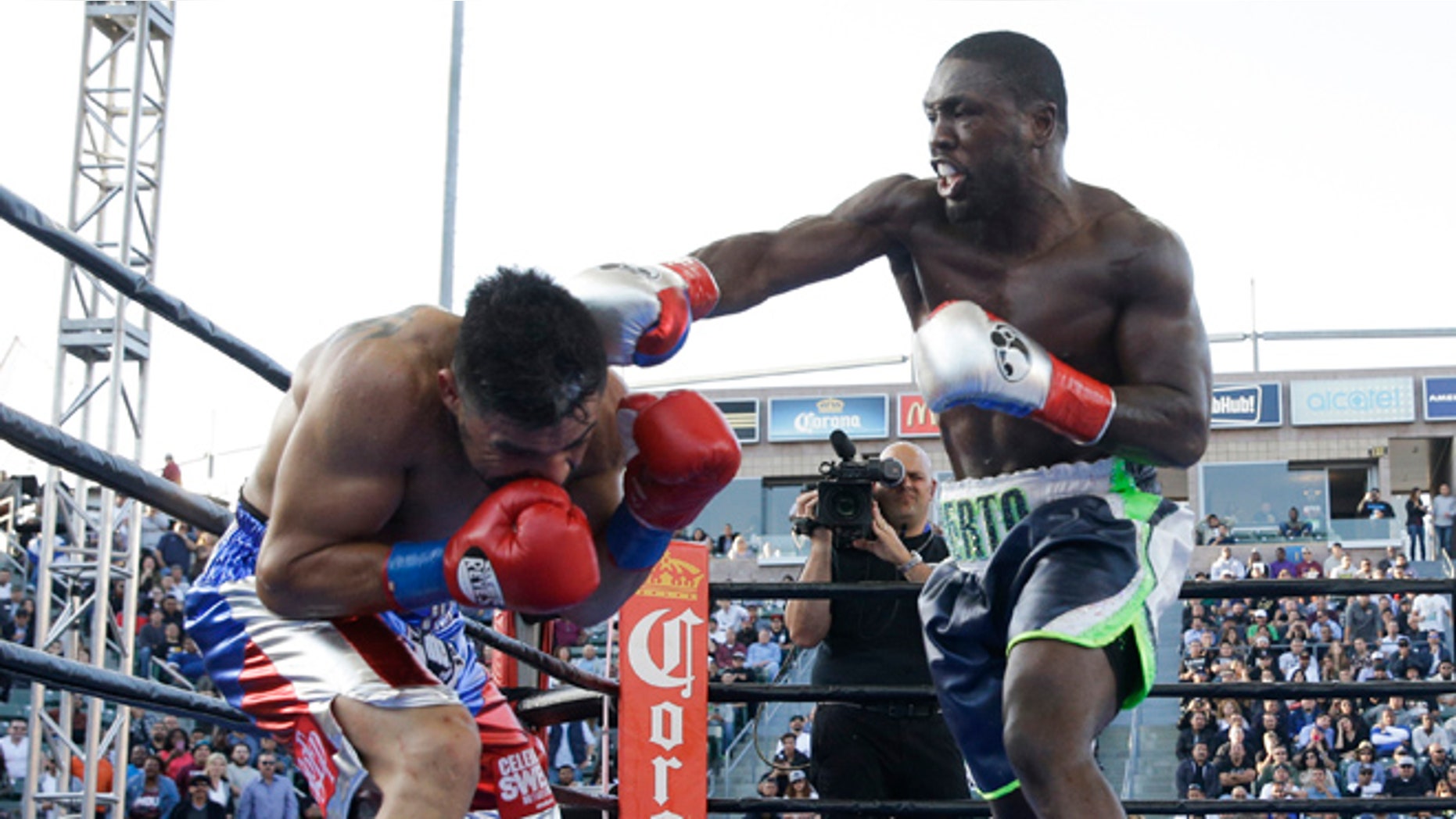 Andre Berto, right, lands a punch to Victor Ortiz during the fourth round of a welterweight boxing match, Saturday, April 30, 2016, in Carson, Calif. Berto won by knockout in the fourth round. (AP Photo/Jae C. Hong)