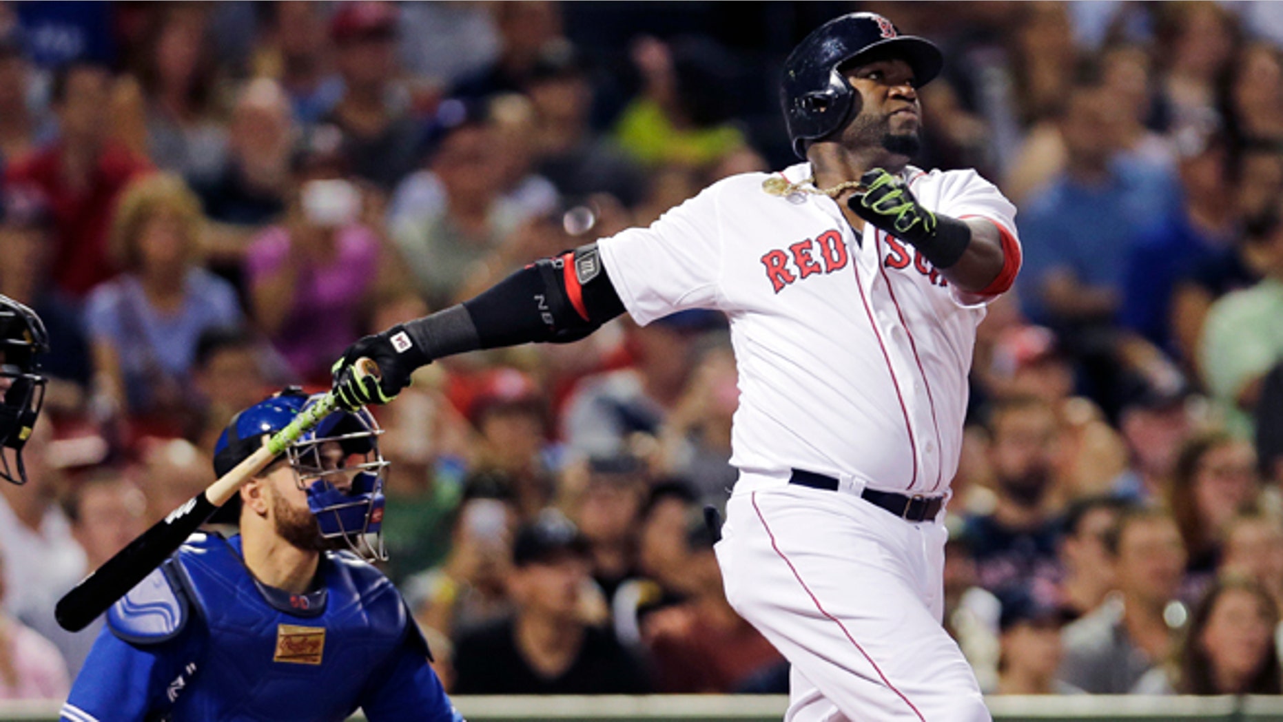 Boston Red Sox designated hitter David Ortiz watches his 498th career home run, off Toronto Blue Jays starting pitcher Drew Hutchison during the third inning of a baseball game at Fenway Park in Boston, Wednesday, Sept. 9, 2015. (AP Photo/Charles Krupa)