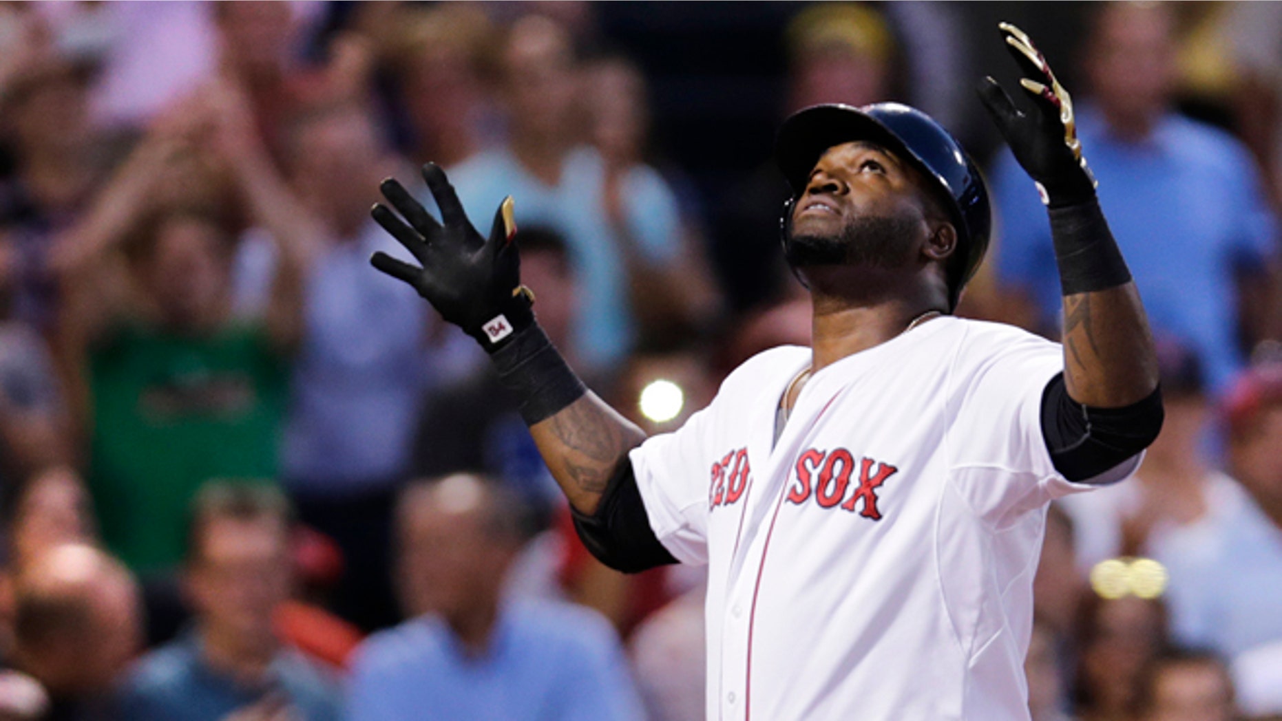 Boston Red Sox designated hitter David Ortiz reacts as he crosses home plate after his solo home run off Cleveland Indians starting pitcher Corey Kluber during the second inning of a baseball game at Fenway Park in Boston, Wednesday, Aug. 19, 2015. (AP Photo/Charles Krupa)