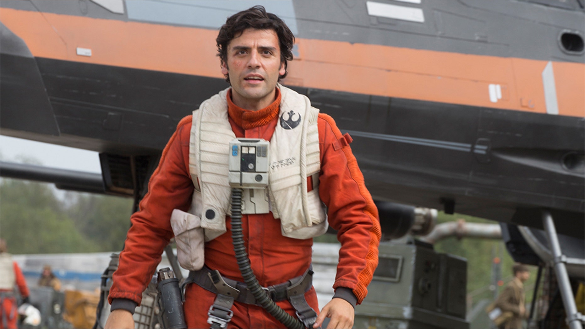 This photo provided by Disney/Lucasfilm shows Oscar Isaac as Poe Dameron in a scene from "Star Wars: The Force Awakens," directed by J. J. Abrams. The new film releases in U.S. theaters on Dec. 18, 2015. (David James/Disney/Lucasfilm via AP)
