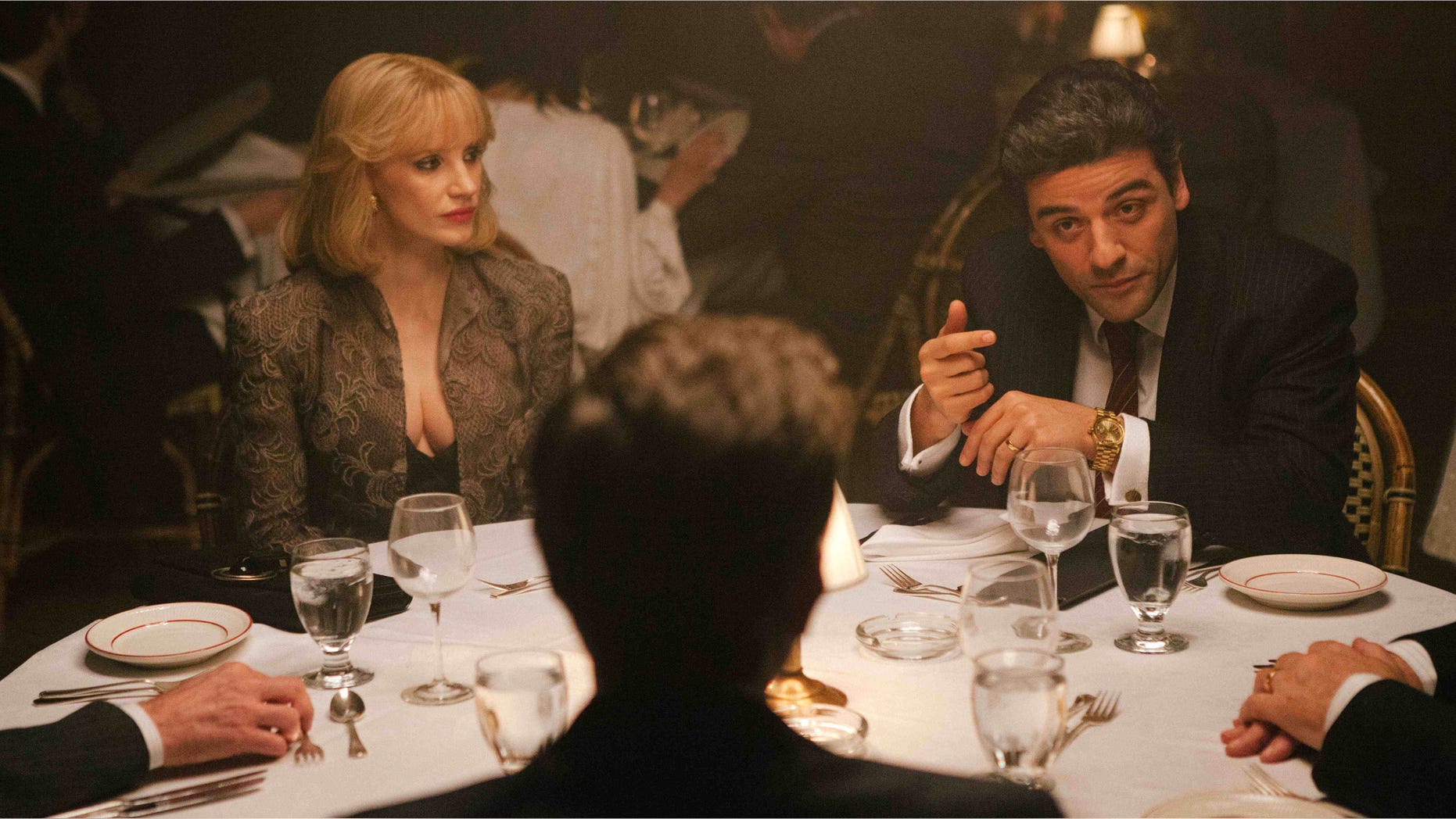 In this image released by A24 Films, Jessica Chastain, left, and Oscar Isaac appear in a scene from "A Most Violent Year." Chastain was nominated for a Golden Globe for best supporting actress in a drama for her role in the film on Thursday, Dec. 11, 2014. The 72nd annual Golden Globe awards will air on NBC on Sunday, Jan. 11. (AP Photo/A24 Films, Atsushi Nishijima)