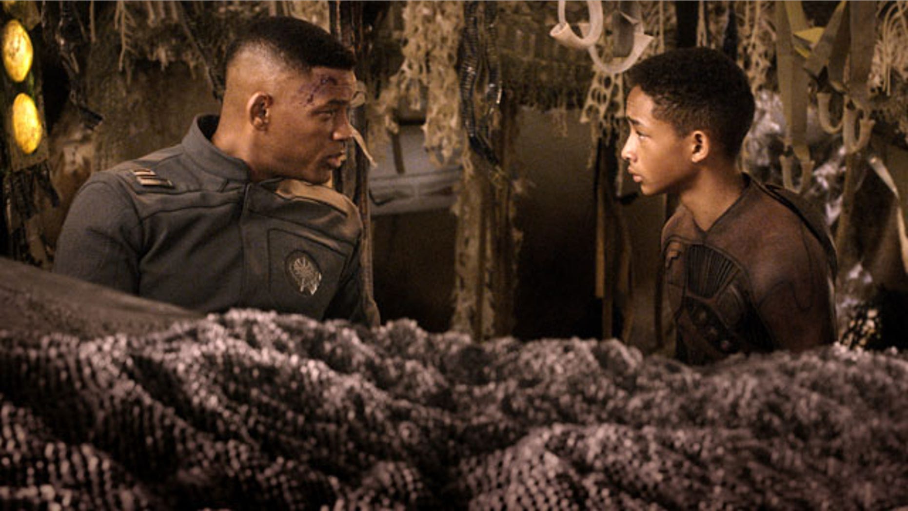 This film publicity image released by Sony - Columbia Pictures shows Will Smith, left, and Jaden Smith in a scene from "After Earth." (AP Photo/Sony, Columbia Pictures)
