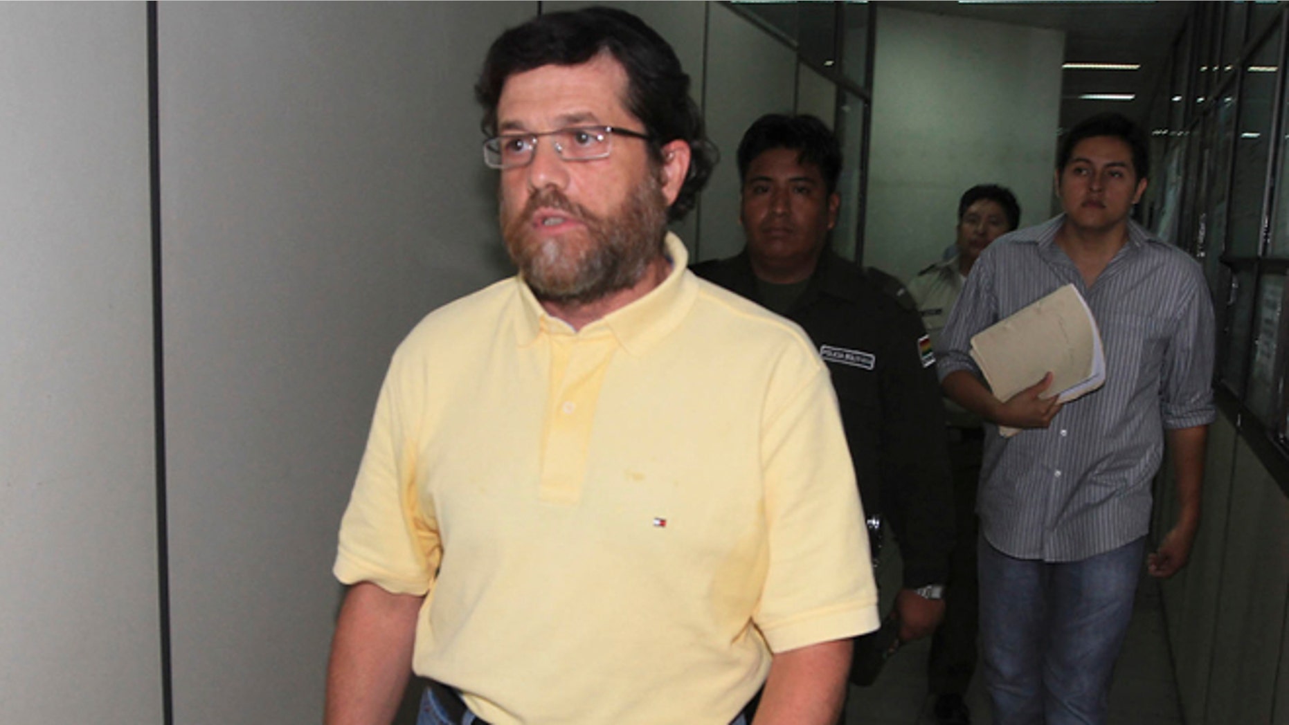 March 21, 2012: Jacob Ostreicher, a New York City businessman, left, arrives at a court to attend a hearing in Santa Cruz, Bolivia.