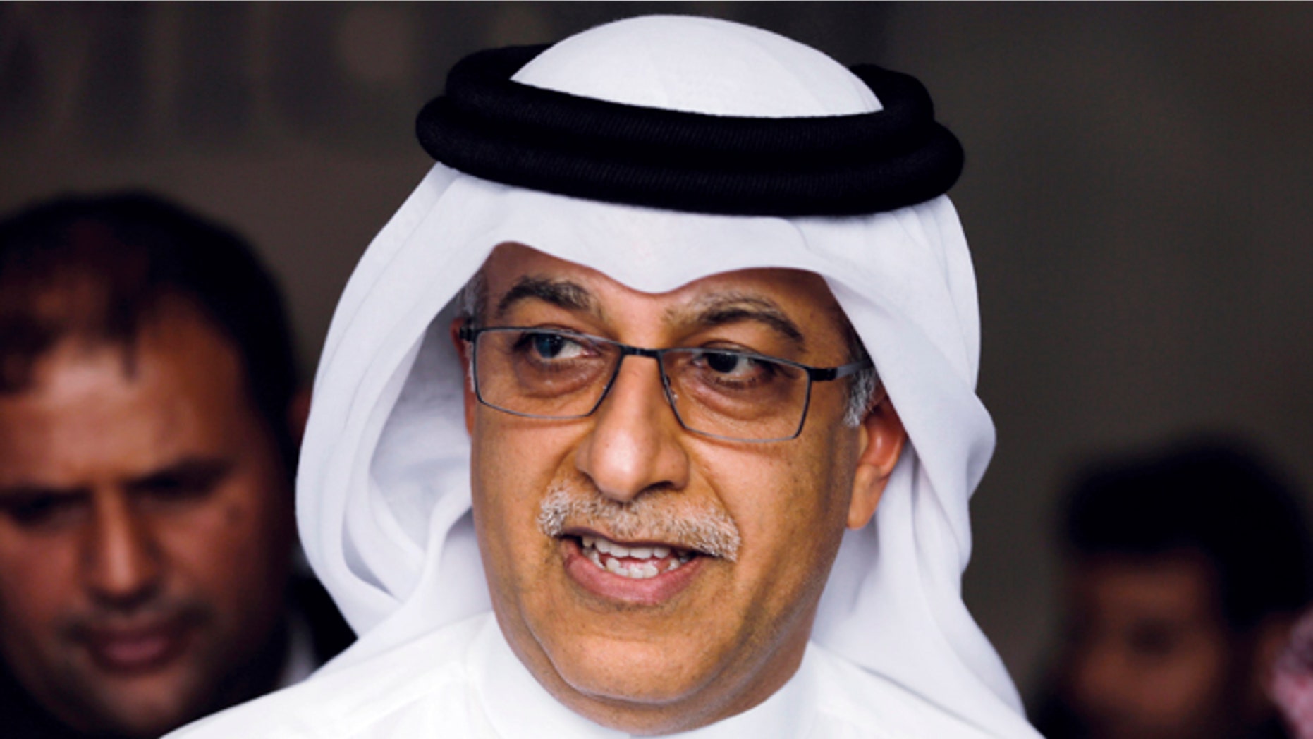 FILE - In this April 30, 2015 file photo, Asian Football Confederation President Sheikh Salman leaves the AFC Congress in Manama, Bahrain. The Sepp Blatter era at FIFA is set to finally end Friday, Feb. 26, 2016, when soccerâs scandal-scarred world body picks a new president after nine months of crisis. Two front-runners have emerged in a five-candidate contest: Asiaâs soccer leader, Sheikh Salman of Bahrain, and Gianni Infantino, the Swiss general secretary of European governing body UEFA. (AP Photo/Hasan Jamali, File)