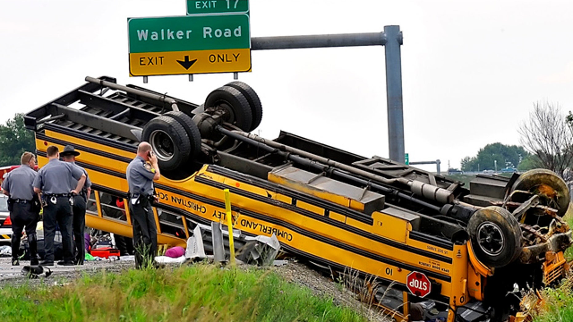 June 26: Pennsylvania State Police look over an overturned school bus after it was involved in a accident with another vehicle on Interstate 81 in Chambersburg, Pa.