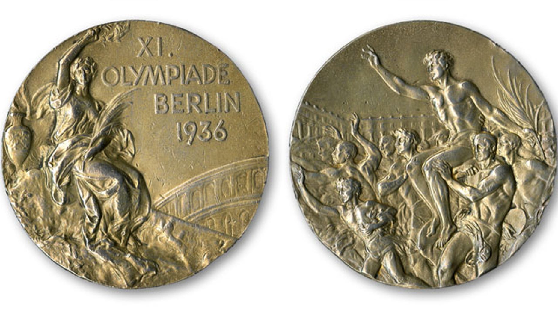December 2, 2013: This handout provided by SCP Auctions, Inc., shows the front, left, and back, right, of one of Jesse Owens' four gold medals won at the 1936 Olympics in Berlin. SCP Auctions says the medal could go for more than $1 million when the auction opens. (AP Photo/SCP Auctions, Inc.)