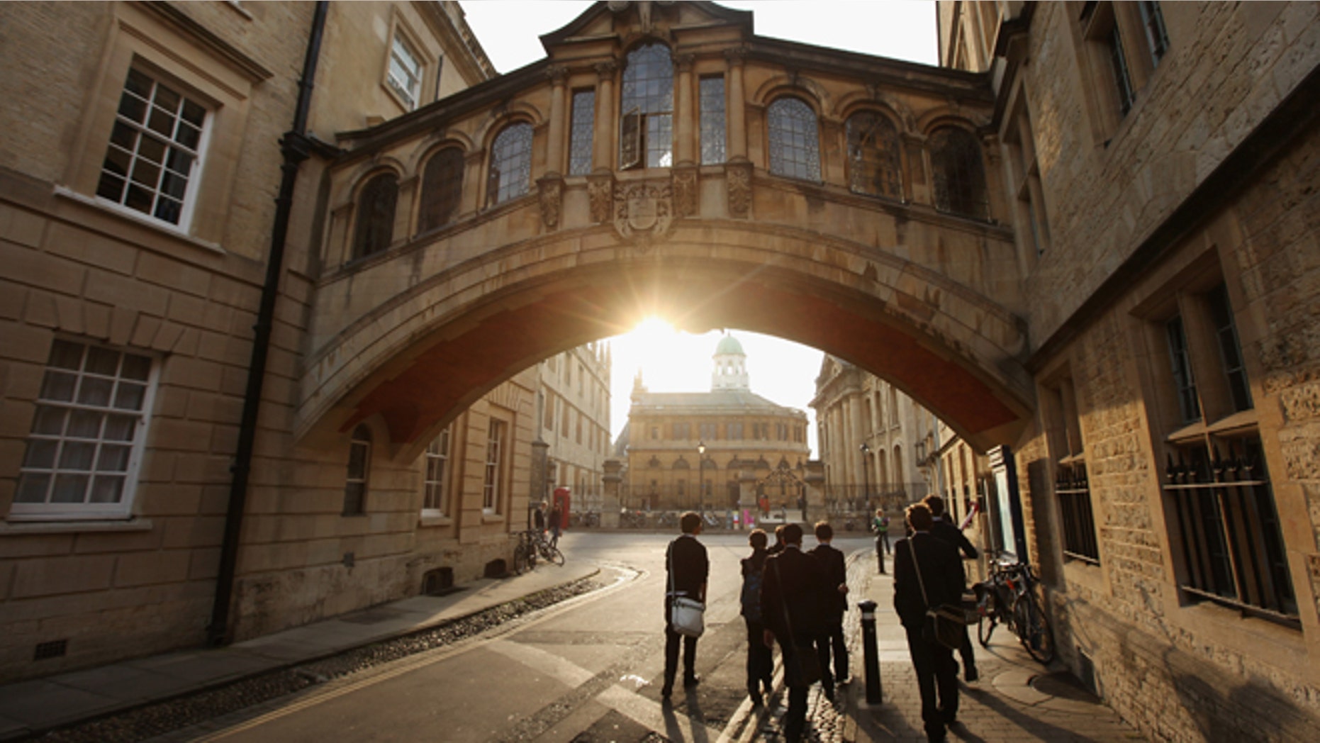 Students walk under the Bridge of Sighs along New College Lane on March 22, 2012 in Oxford, England.