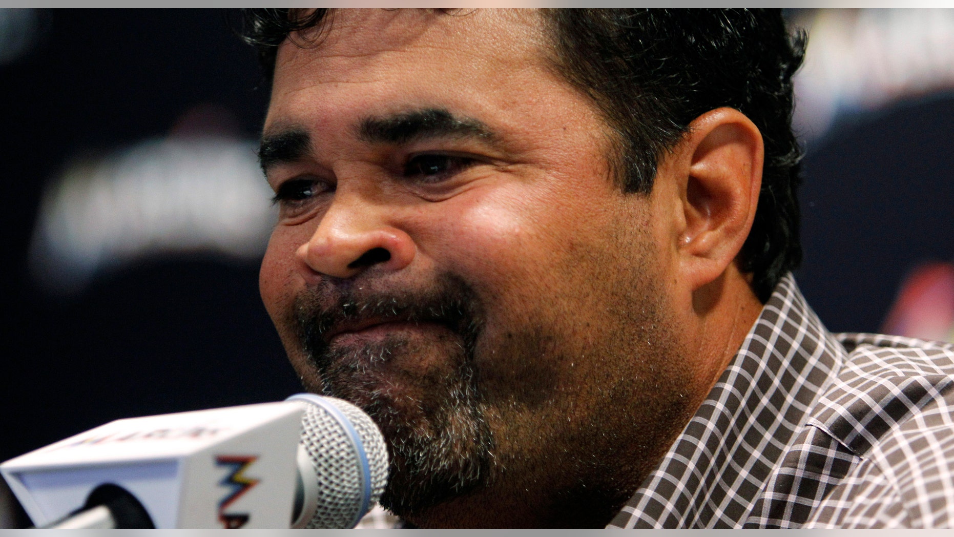 Miami Marlins manager Ozzie Guillen gestures during at a news conference at Marlins Stadium in Miami, Tuesday April 10, 2012. Guillen has been suspended for five games because of his comments about Fidel Castro. He has again apologized and says he accepts the punishment. (AP Photo/Lynne Sladky)
