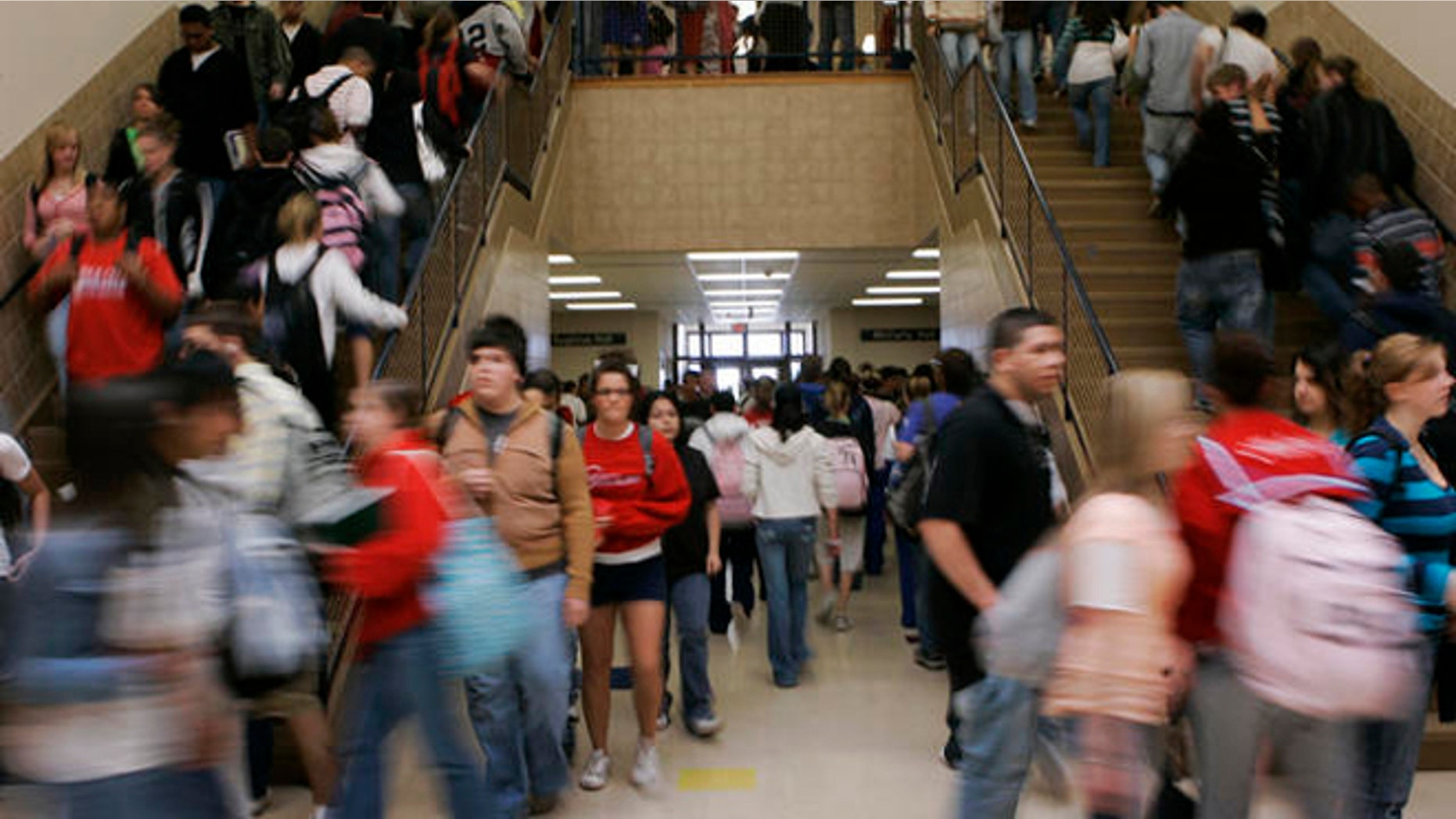 ** ADVANCE FOR SUNDAY, AUG. 19 **Students move between classes at Dodge City High School in Dodge City, Kan., Wednesday, April 4, 2007. Seventy per cent of the students at the school are Hispanic. (AP Photo/Orlin Wagner)