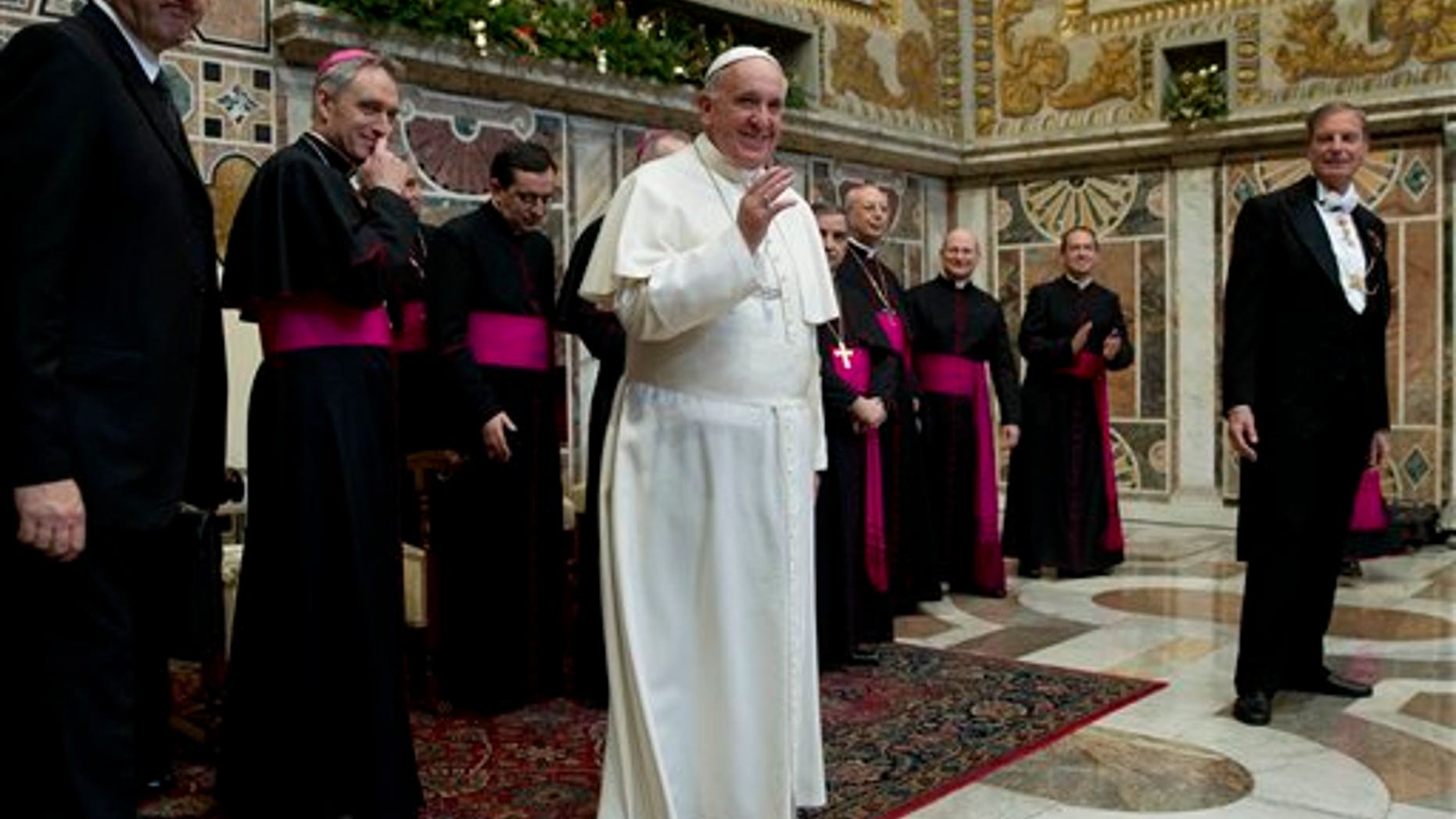 Pope Francis meets ambassadors to the Holy See, at the Vatican, Monday, Jan. 13, 2014. Pope Francis on Monday criticized abortion as evidence of a "throwaway culture" that wastes people as well as food, saying such a mentality is a threat to world peace. Francis also urged better respect for migrants and denounced the persecution of Christians in Asia, Africa and the Middle East in his global survey of world crises delivered to diplomats accredited to the Holy See. (AP Photo/Andrew Medichini, Pool)