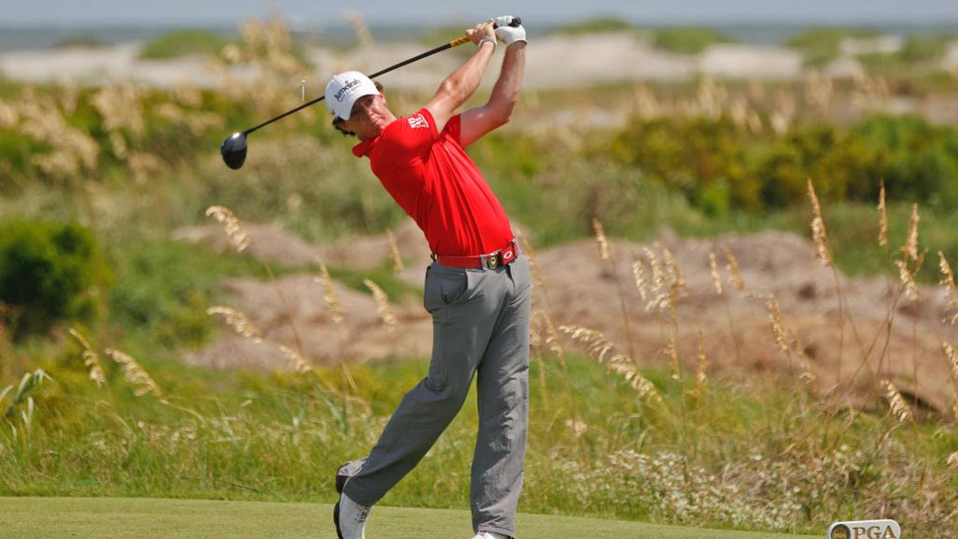 FILE - In this Aug. 12, 2012, file photo, Rory McIlroy of Northern Ireland hits from the sixth tee during the final round of the PGA Championship golf tournament on the Ocean Course of the Kiawah Island Golf Resort in Kiawah Island, S.C. The PGA Championship is expected to return to the Ocean Course in 2021. (AP Photo/Evan Vucci, File)