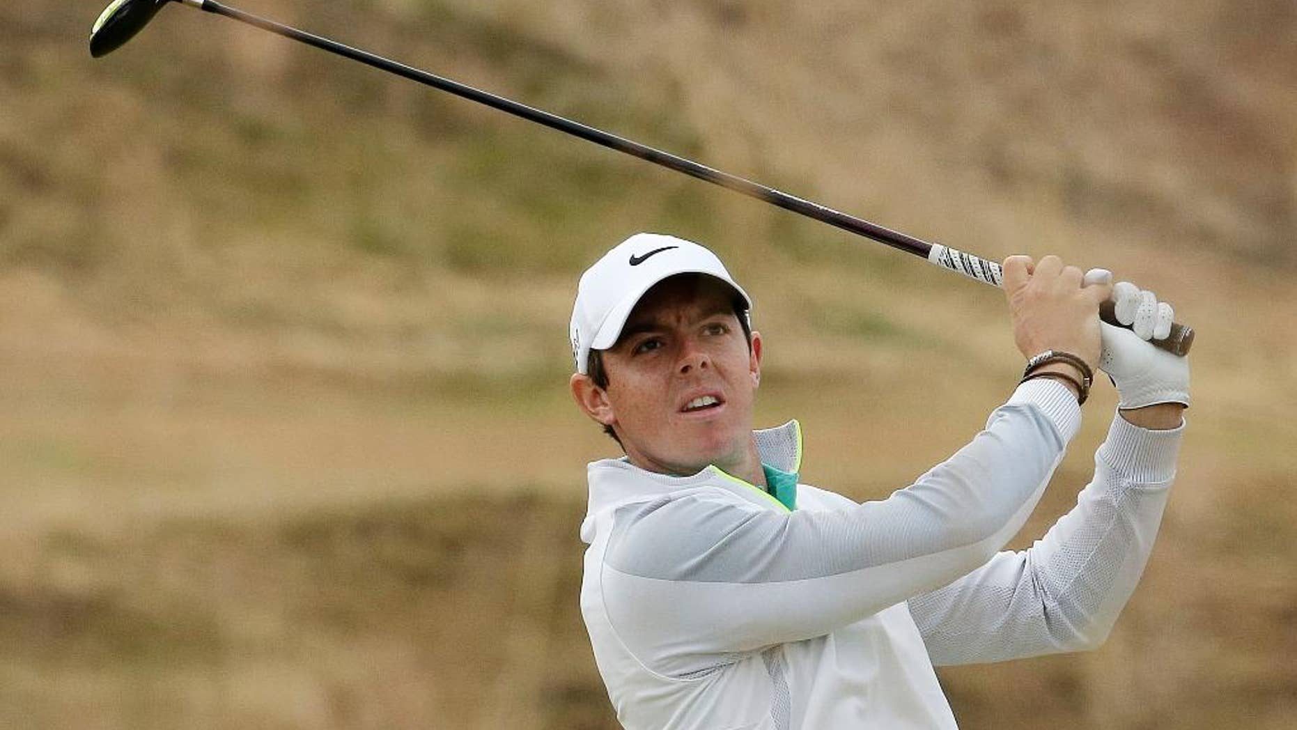 FILE - In this Thursday, June 18, 2015 file photo, Rory McIlroy, of Northern Ireland, watches his tee shot on the 10th hole during the first round of the U.S. Open golf tournament at Chambers Bay in University Place, Wash. Rory McIlroy posted two videos on Instagram that suggest he might be able to return for the PGA Championship, Thursday, Aug. 6, 2015. (AP Photo/Charlie Riedel, File)