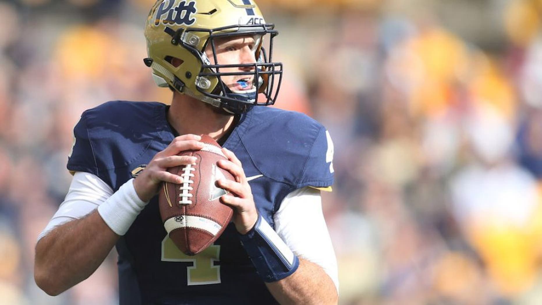 Nov 27, 2015; Pittsburgh, PA, USA; Pittsburgh Panthers quarterback Nathan Peterman (4) looks to pass against the Miami Hurricanes during the first quarter at Heinz Field. Mandatory Credit: Charles LeClaire-USA TODAY Sports