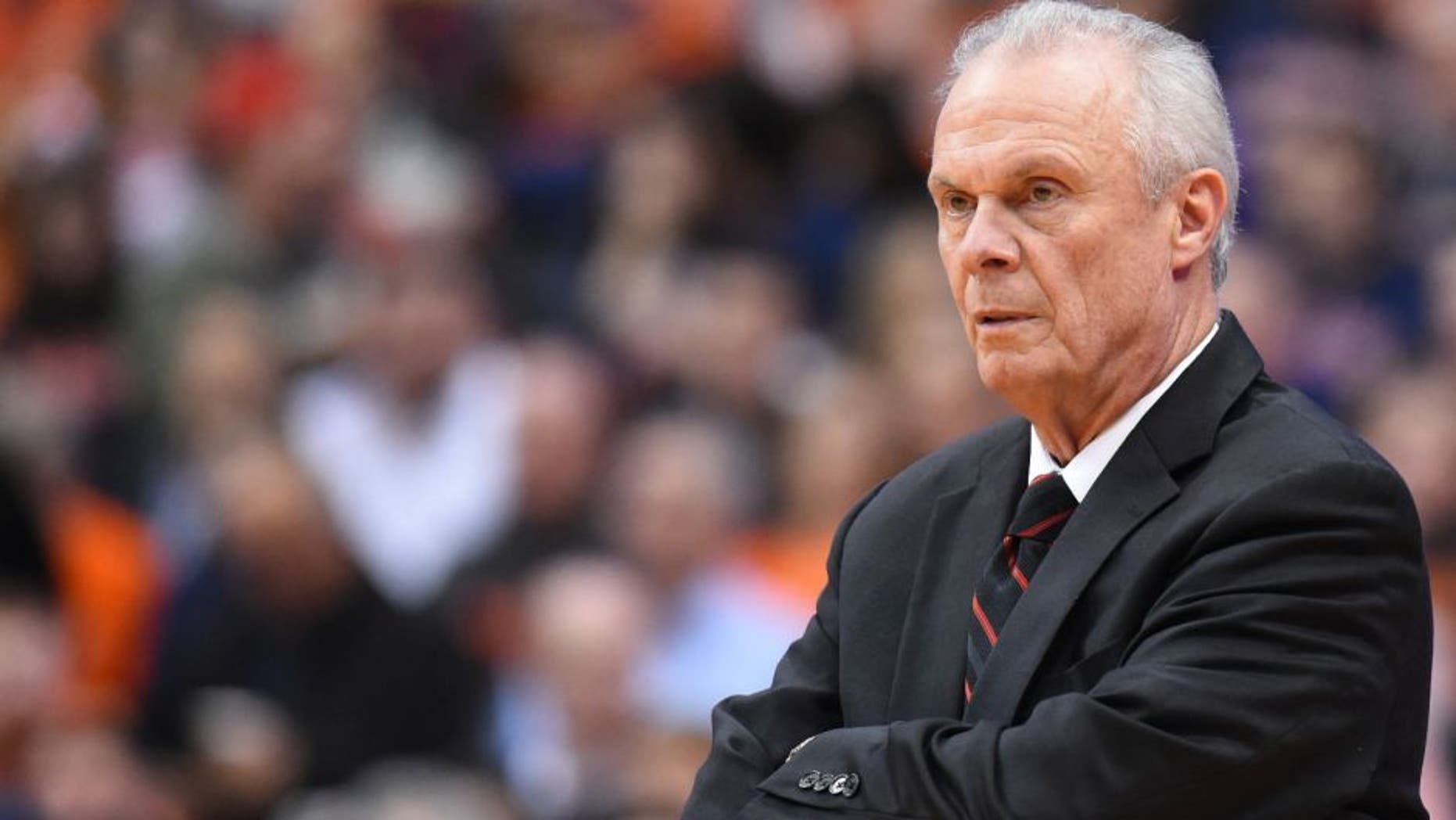 Former Wisconsin Badgers head coach Bo Ryan reacts to a play against the Syracuse Orange during the first half at the Carrier Dome.