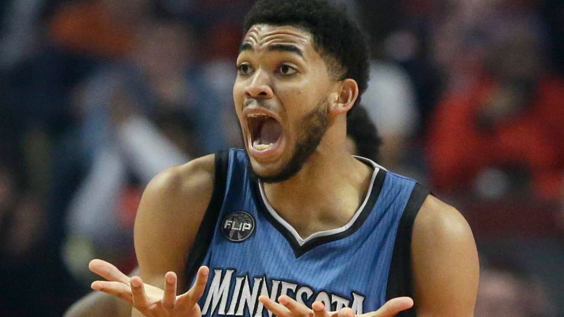 Minnesota Timberwolves center Karl-Anthony Towns reacts to a call during the first half of an NBA basketball game against the Chicago Bulls on Saturday, Nov. 7, 2015, in Chicago. (AP Photo/Nam Y. Huh)