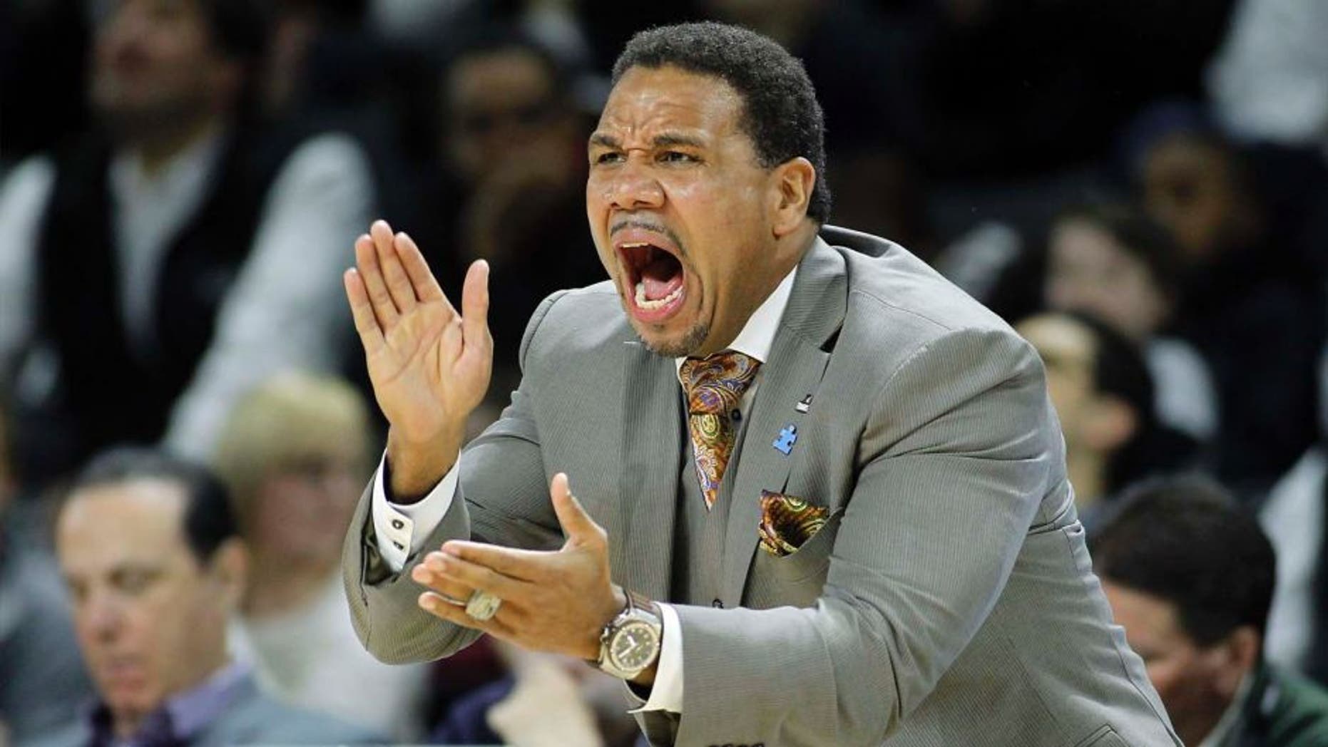 Providence head coach Ed Cooley applauds the play of his team during the first half against Marquette in Providence, R.I.