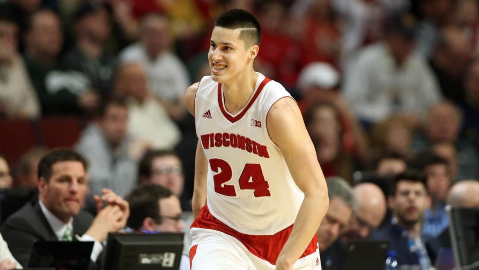 Wisconsin Badgers guard Bronson Koenig reacts after making a three-pointer against the Purdue Boilermakers during the second half in the semifinals of the Big Ten tournament in Chicago.