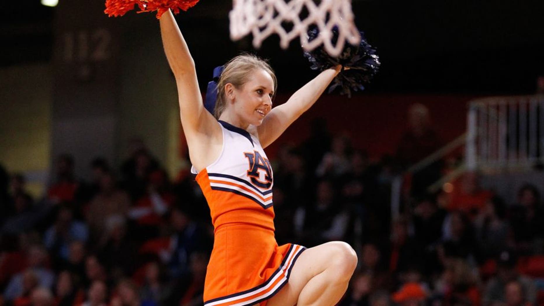 Jan 18, 2014; Auburn, AL, USA; Auburn Cheerleader during the game against the Florida Gators at Auburn Arena. The Gators defeated the Tigers 68-61. Mandatory Credit: Marvin Gentry-USA TODAY Sports