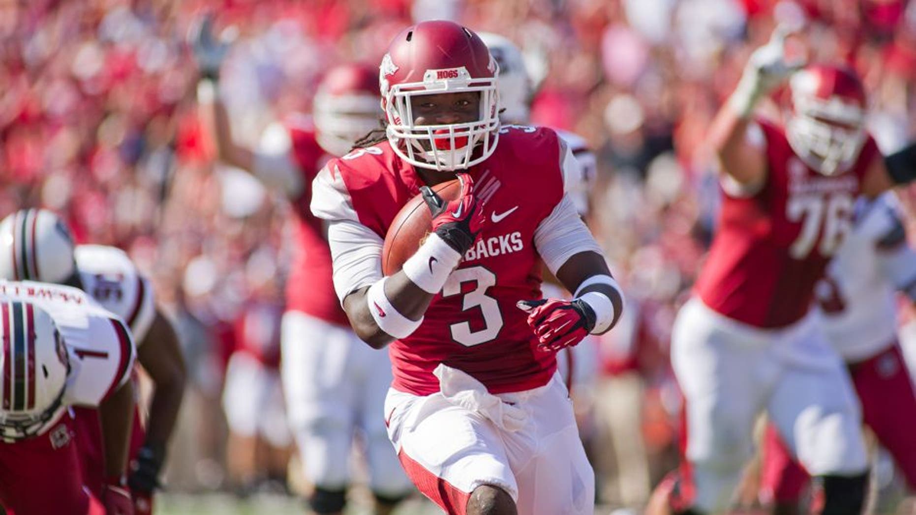 Oct 12, 2013; Fayetteville, AR, USA; Arkansas Razorbacks running back Alex Collins (3) runs with the ball during a game against the South Carolina Gamecocks at Donald W. Reynolds Razorback Stadium. South Carolina defeated Arkansas 52-7. Mandatory Credit: Beth Hall-USA TODAY Sports