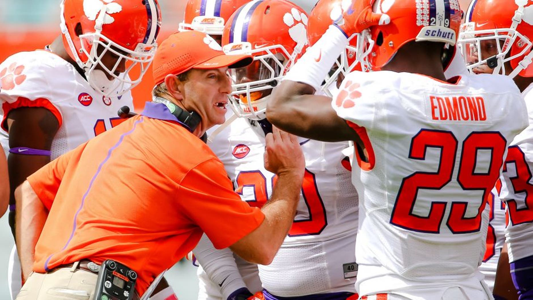 Oct 24, 2015; Miami Gardens, FL, USA; Clemson Tigers head coach Dabo Swinney talks with his players during the first half against the Miami Hurricanes at Sun Life Stadium. Mandatory Credit: Steve Mitchell-USA TODAY Sports