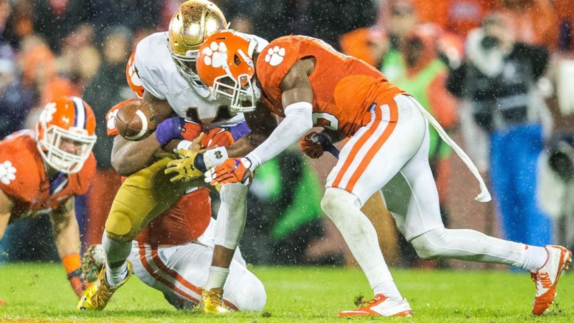 Oct 3, 2015; Clemson, SC, USA; Notre Dame Fighting Irish quarterback DeShone Kizer (14) fumbles as he is hit by Clemson Tigers safety T.J. Green (15) in the fourth quarter at Clemson Memorial Stadium. Clemson won 24-22. Mandatory Credit: Matt Cashore-USA TODAY Sports