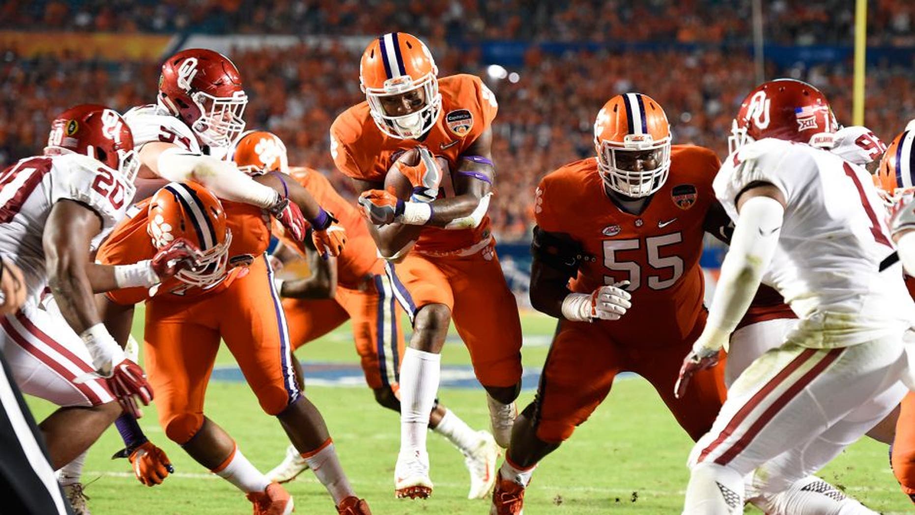 Dec 31, 2015; Miami Gardens, FL, USA; Clemson Tigers running back Wayne Gallman (9) runs in to the end zone to score a touchdown against the Oklahoma Sooners in the third quarter of the 2015 CFP Semifinal at the Orange Bowl at Sun Life Stadium. Mandatory Credit: John David Mercer-USA TODAY Sports