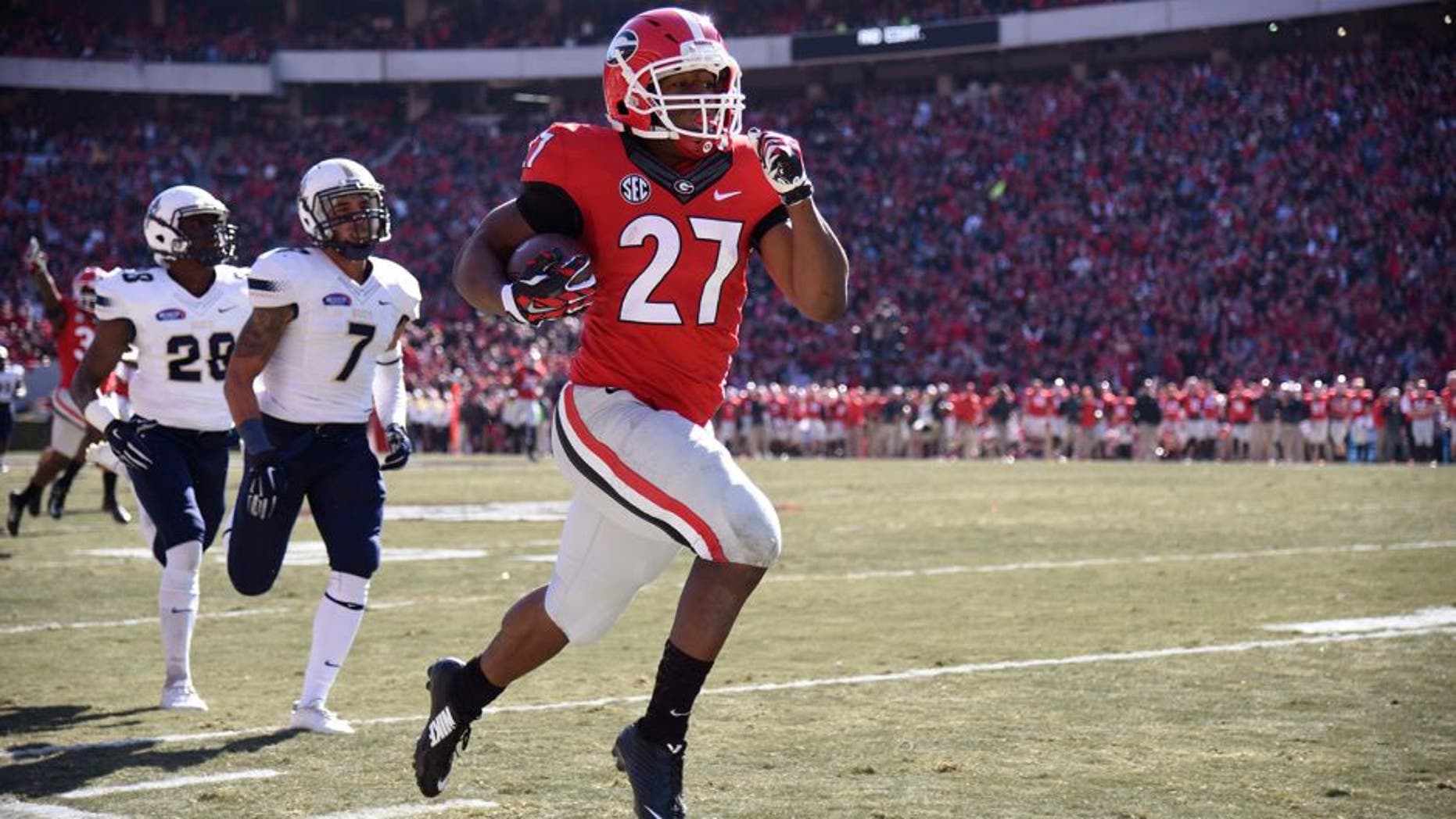 Nov 22, 2014; Athens, GA, USA; Georgia Bulldogs running back Nick Chubb (27) runs 83 yards for a touchdown against the Charleston Southern Buccaneers during the first quarter at Sanford Stadium. Mandatory Credit: Dale Zanine-USA TODAY Sports
