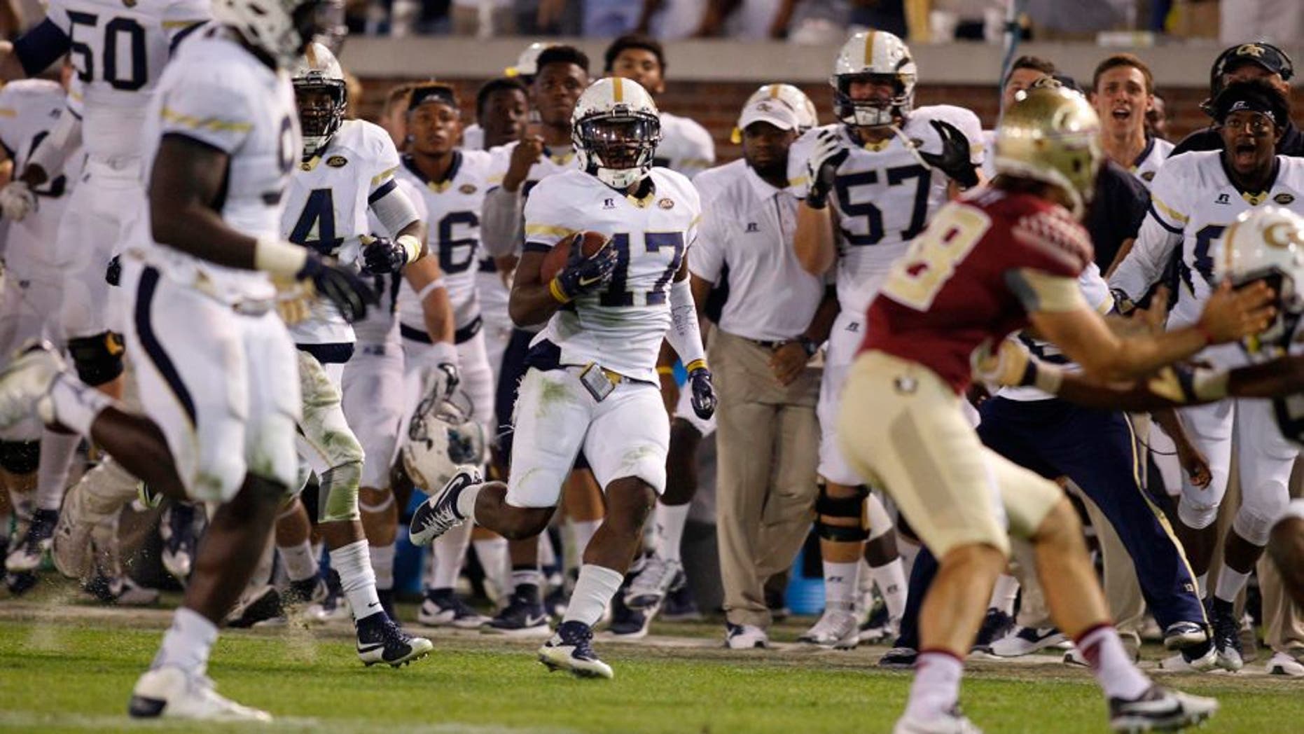 Oct 24, 2015; Atlanta, GA, USA; Georgia Tech Yellow Jackets defensive back Lance Austin (17) returns a blocked kick for a game winning touchdown against the Florida State Seminoles in the fourth quarter at Bobby Dodd Stadium. Georgia Tech defeated Florida State 22-16. Mandatory Credit: Brett Davis-USA TODAY Sports