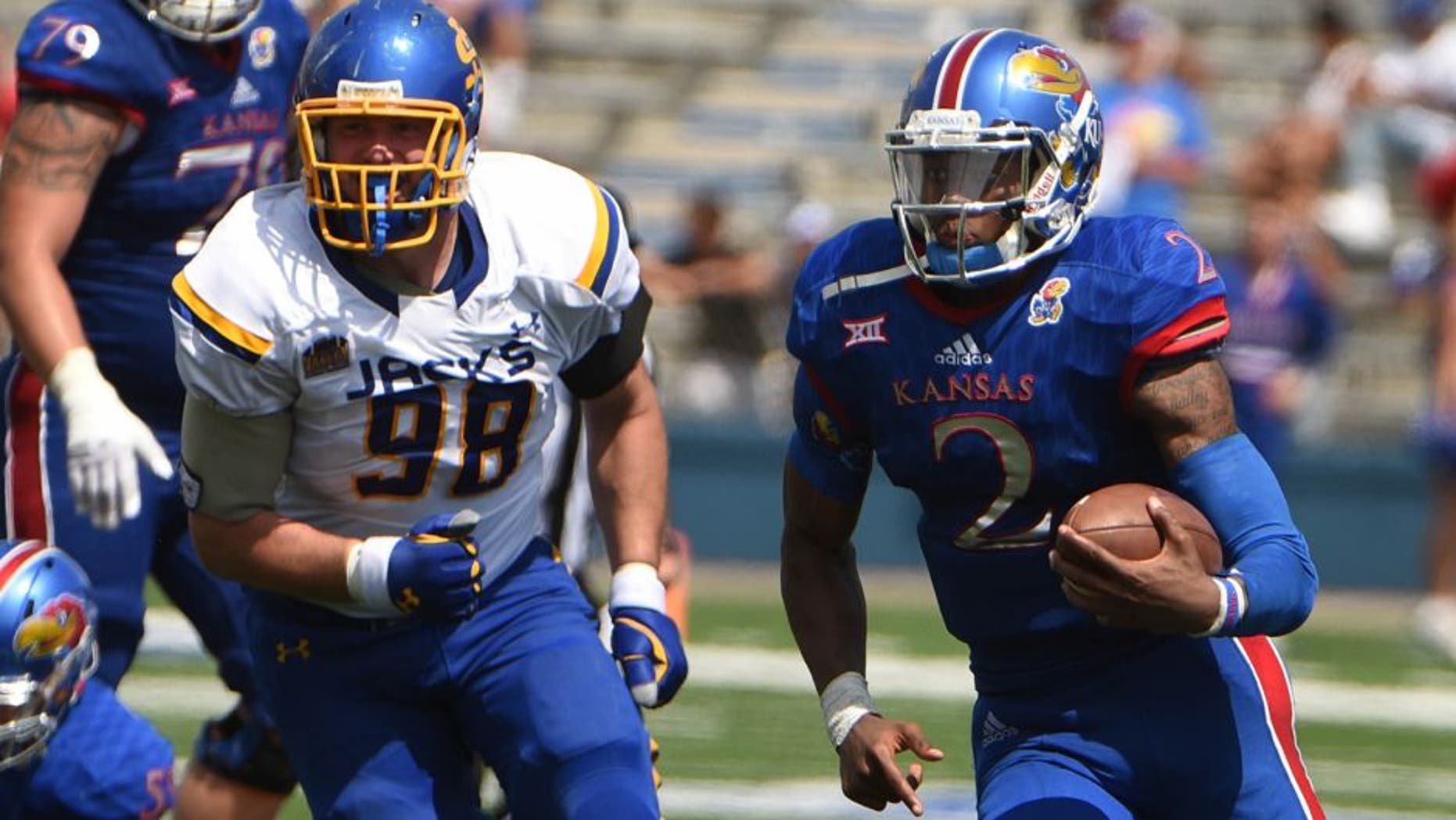 Sep 5, 2015; Lawrence, KS, USA; Kansas Jayhawks quarterback Montell Cozart (2) runs for yardage against the South Dakota State Jackrabbits in the second half at Memorial Stadium. South Dakota State won the game 41-38. Mandatory Credit: John Rieger-USA TODAY Sports