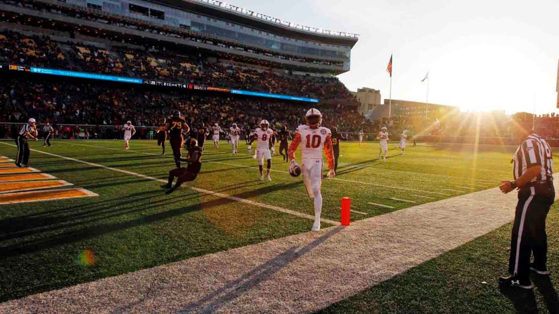 Nebraska defensive back Joshua Kalu crosses the goal line as he returns an interception 41-yards for a touchdown during the second half Saturday, Oct. 17, 2015, in Minneapolis. Nebraska won 48-25.