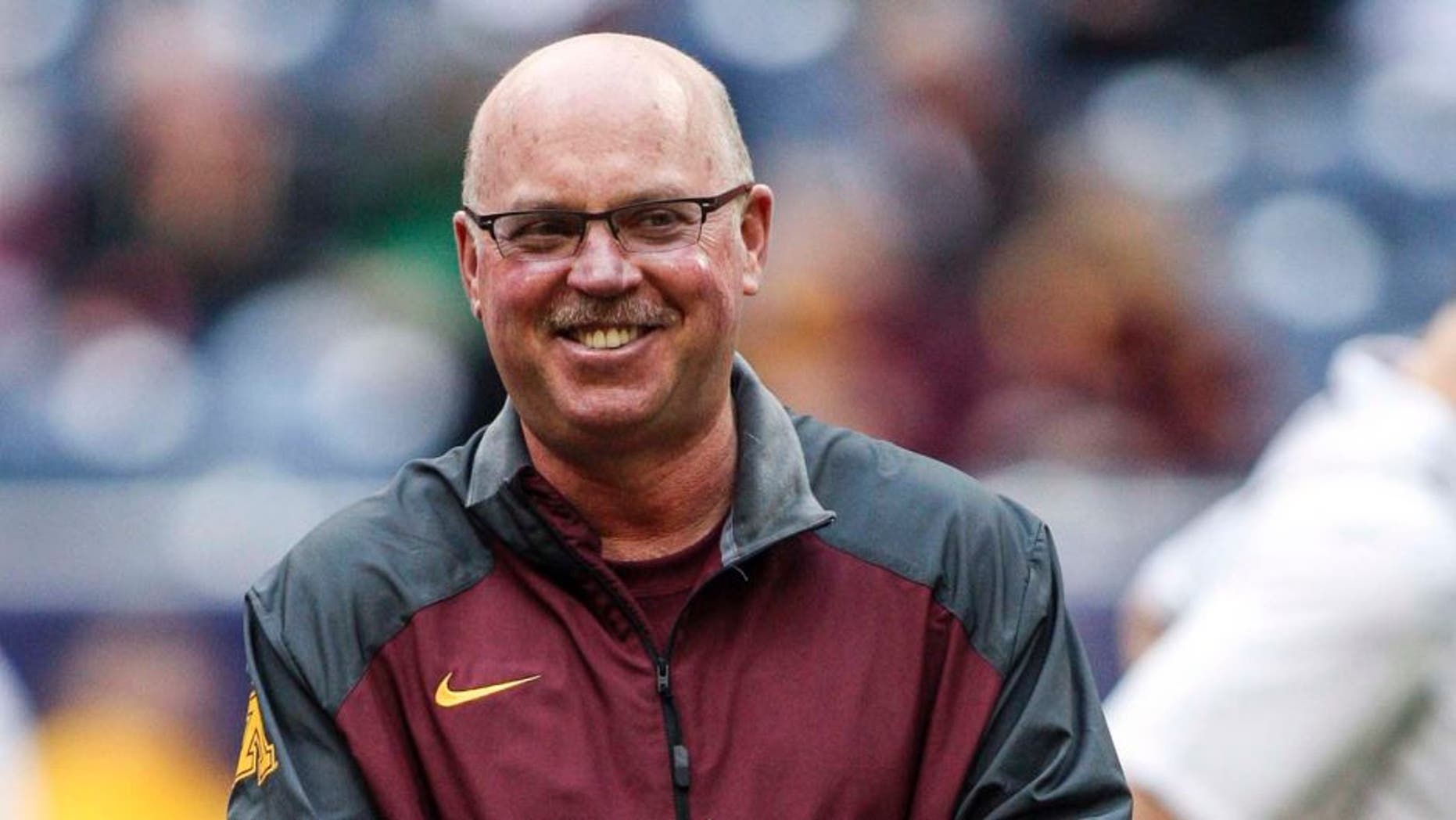 Dec 27, 2013; Houston, TX, USA; Minnesota Golden Gophers head coach Jerry Kill walks on the field before the Texas Bowl against the Syracuse Orange at Reliant Stadium.