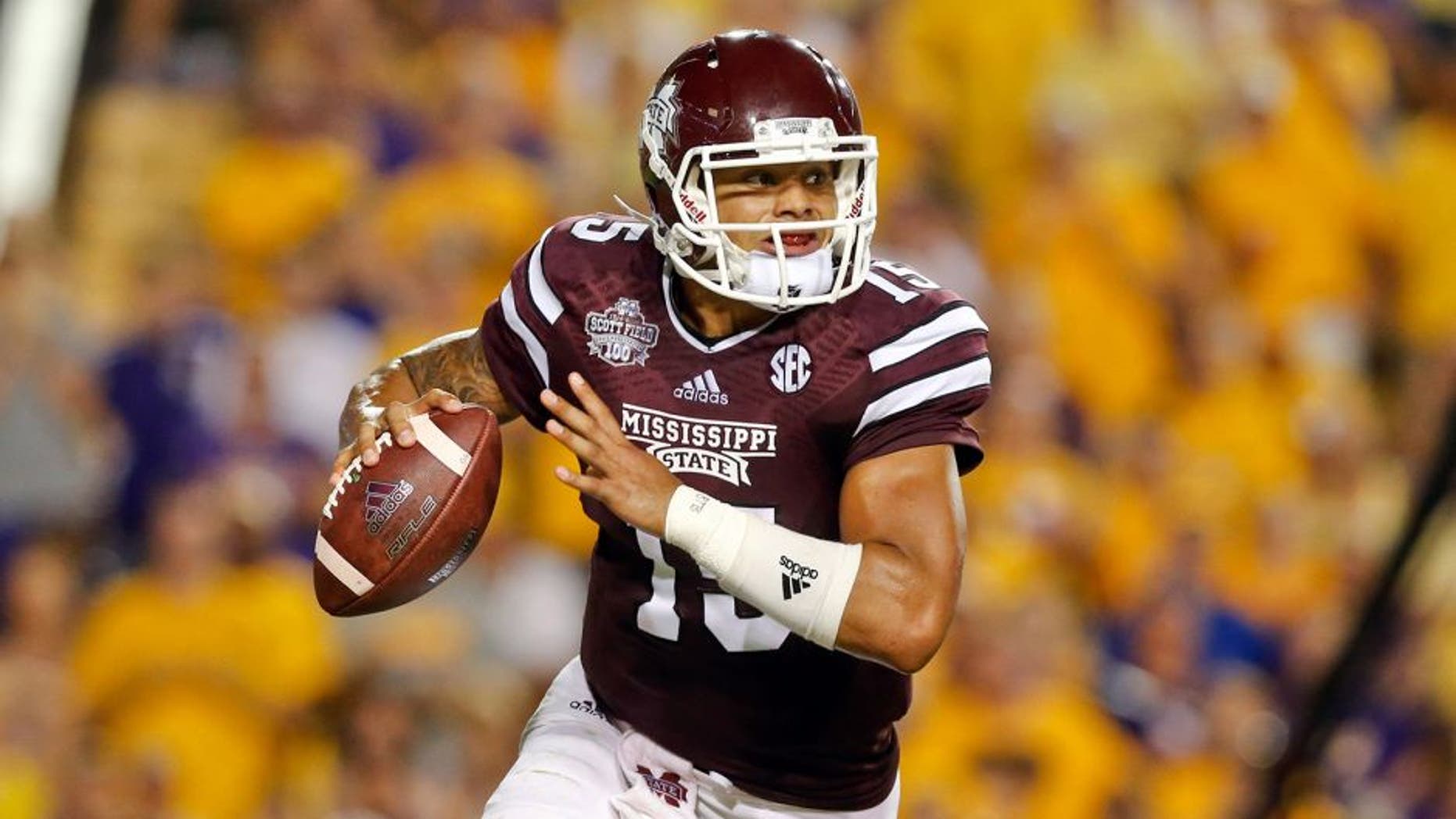 Sep 20, 2014; Baton Rouge, LA, USA; Mississippi State Bulldogs quarterback Dak Prescott (15) looks to pass against the LSU Tigers during the third quarter of a game at Tiger Stadium. Mandatory Credit: Derick E. Hingle-USA TODAY Sports