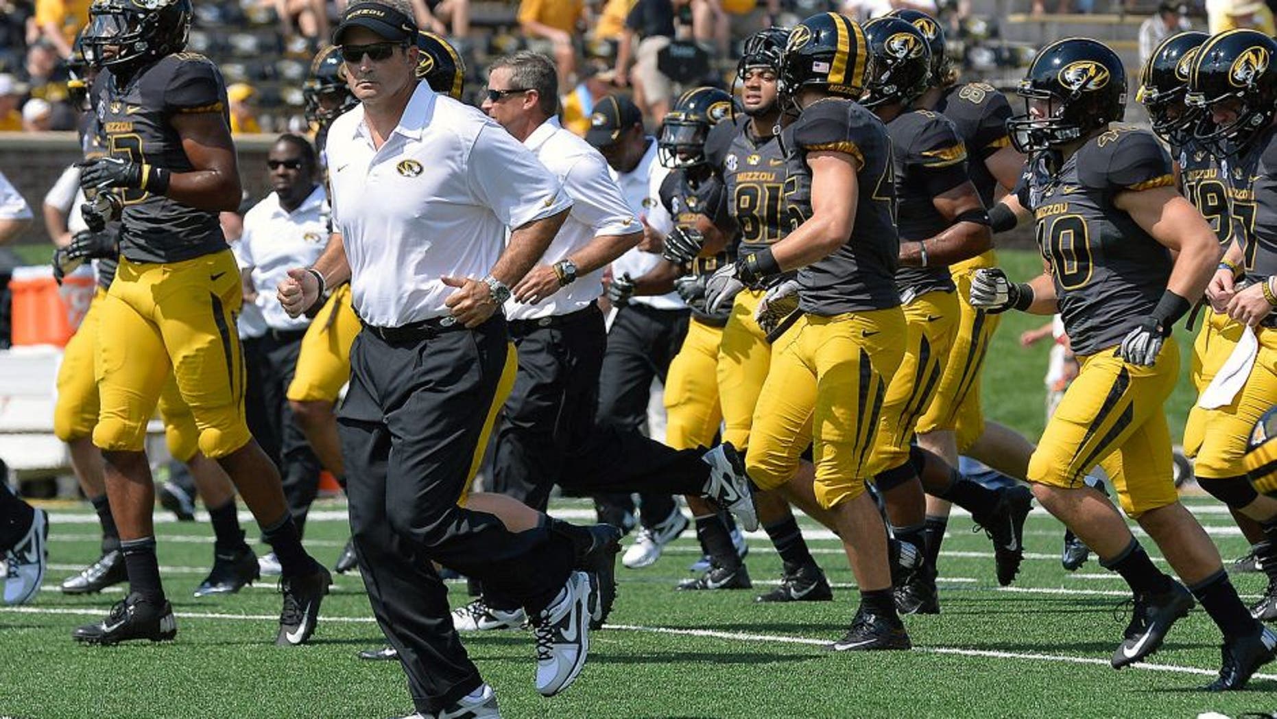 Sep 7, 2013; Columbia, MO, USA; Missouri Tigers head coach Gary Pinkel leads his team off the field prior to the game between the Missouri Tigers and the Toledo Rockets at Faurot Field. Mandatory Credit: Jasen Vinlove-USA TODAY Sports