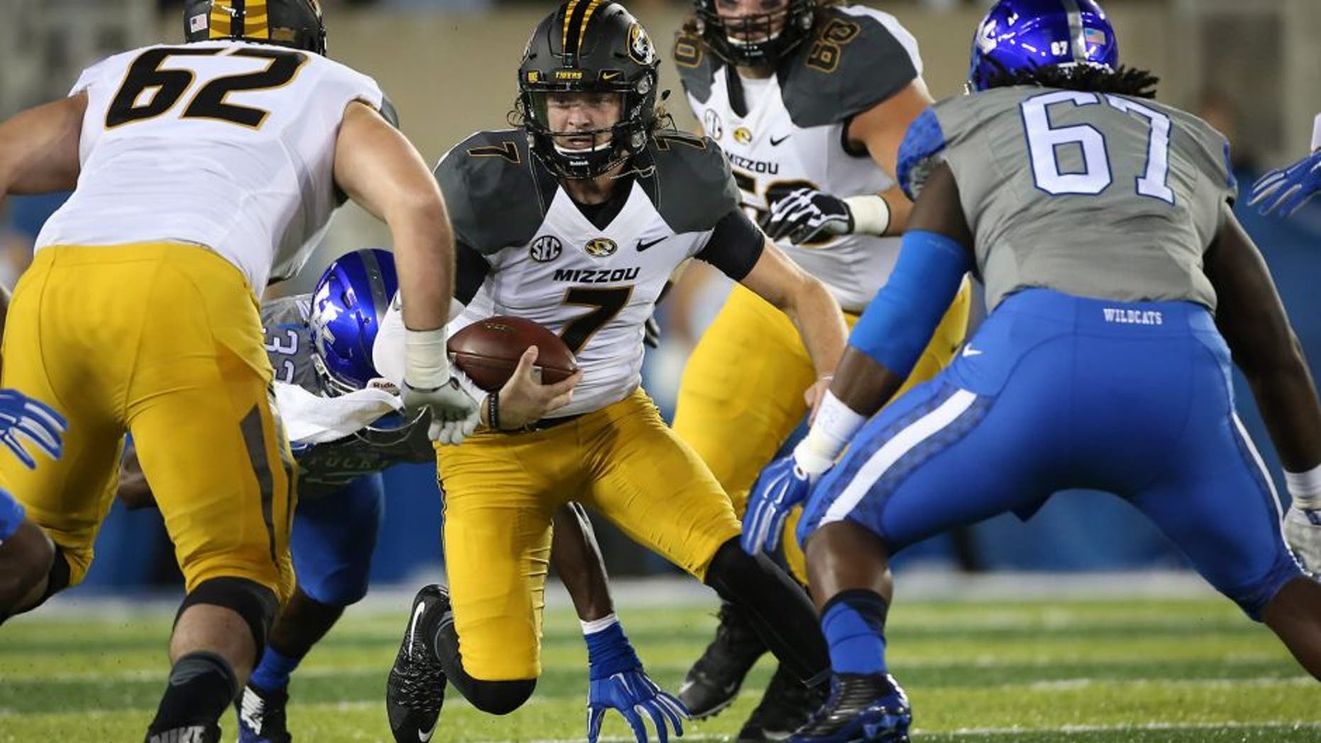 Missouri quarterback Maty Mauk scrambles for an opening during the first half of an NCAA college football game against Kentucky, Saturday, Sept. 26, 2015, in Lexington, Ky. (AP Photo/David Stephenson)