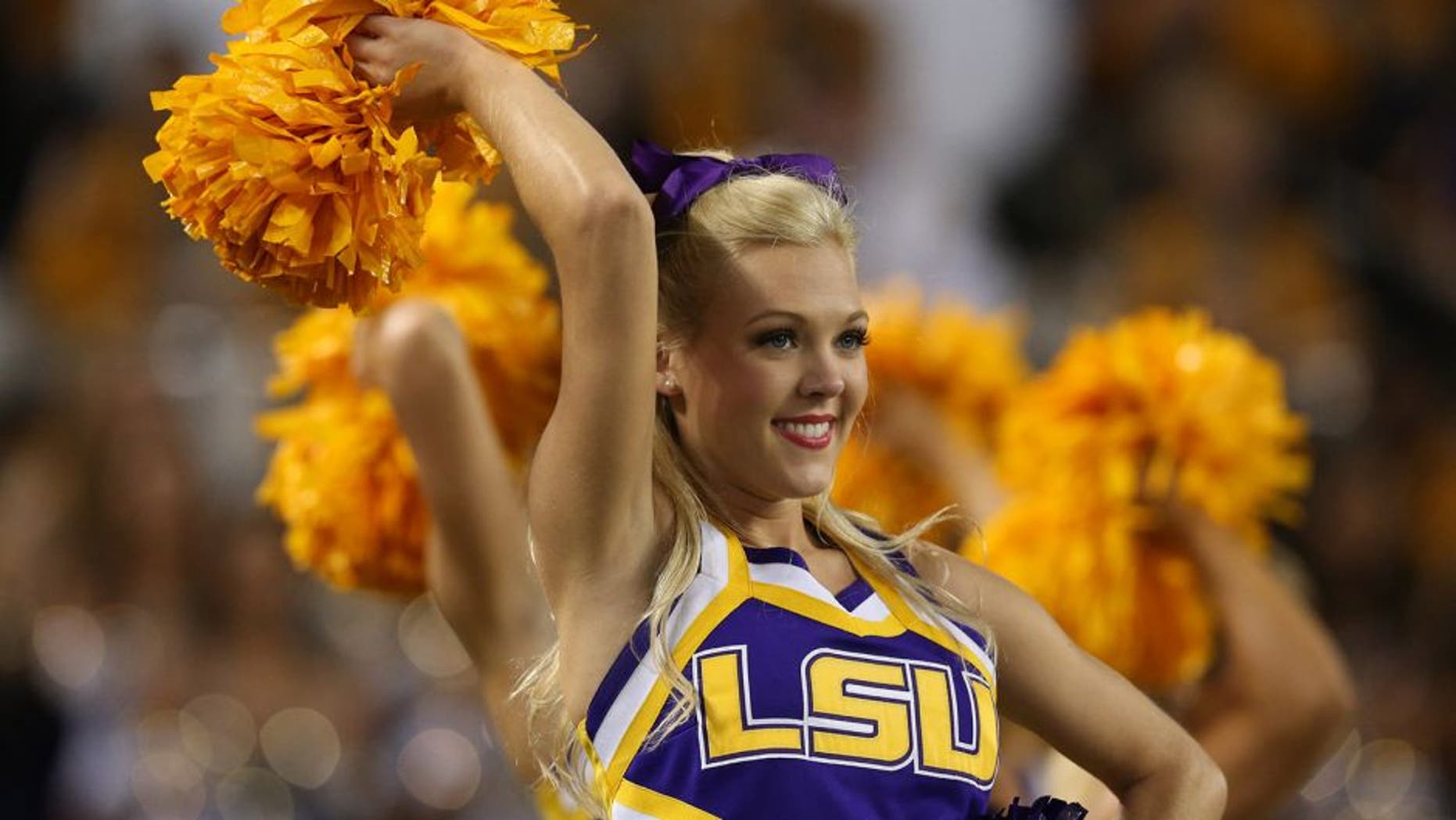 Aug 31, 2013; Arlington, TX, USA; LSU Tigers cheerleaders preform on the sidelines during the game against Texas Christian Horned Frogs at AT&T Stadium. Mandatory Credit: Matthew Emmons-USA TODAY Sports