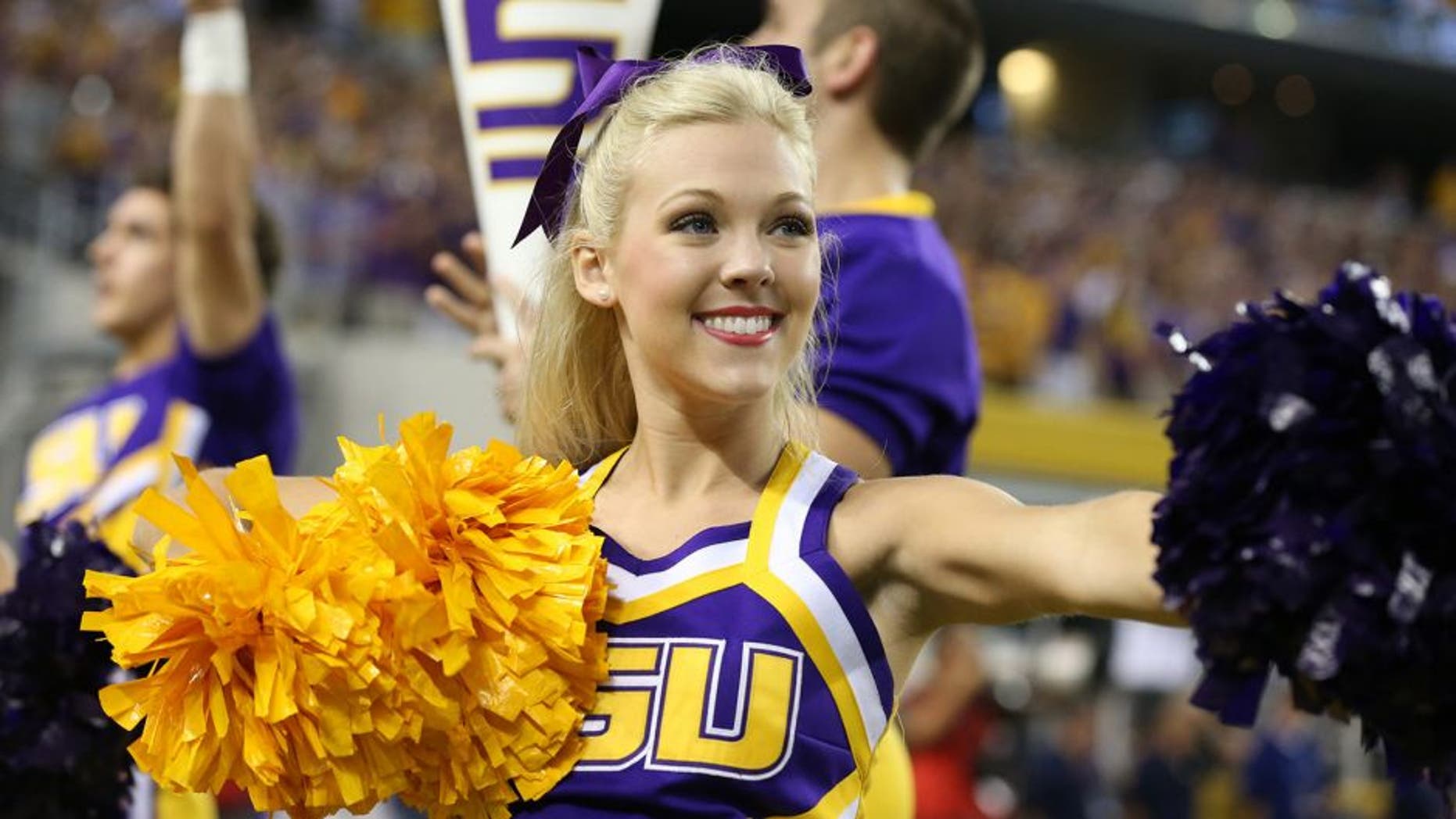 Aug 31, 2013; Arlington, TX, USA; LSU Tigers cheerleaders perform on the sidelines during the game against the Texas Christian Horned Frogs at AT&T Stadium. Mandatory Credit: Matthew Emmons-USA TODAY Sports