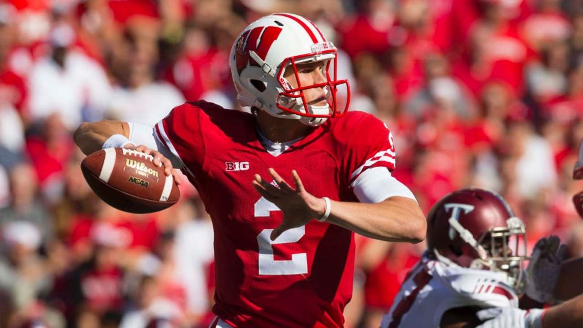 Wisconsin Badgers quarterback Joel Stave throws a pass against the Troy Trojans at Camp Randall Stadium in Madison, Wis., on Saturday, Sept. 19, 2015.