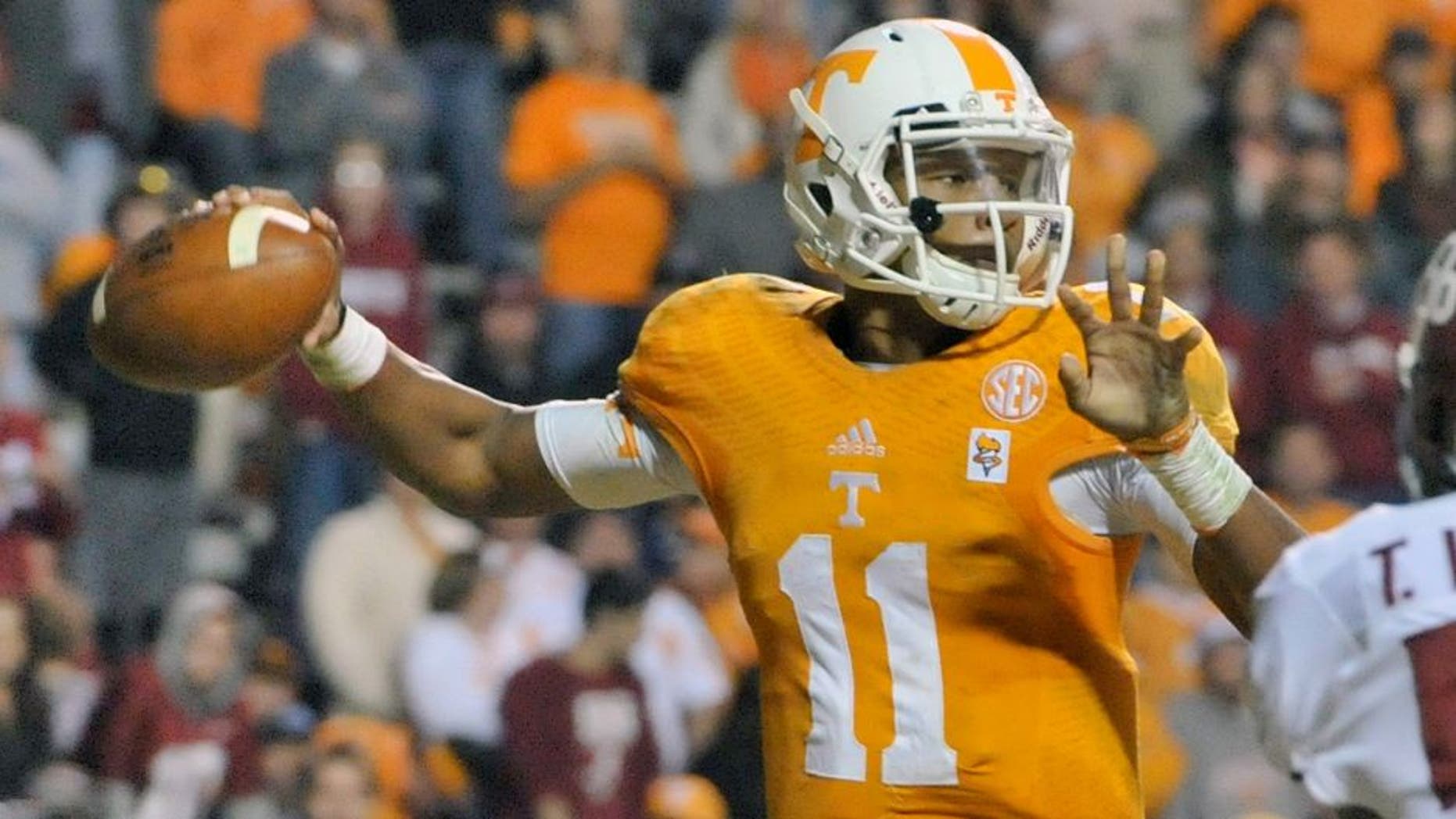 Oct 25, 2014; Knoxville, TN, USA; Tennessee Volunteers quarterback Joshua Dobbs (11) passes against the Alabama Crimson Tide during the second half game at Neyland Stadium. Alabama won 34-20. Mandatory Credit: Jim Brown-USA TODAY Sports