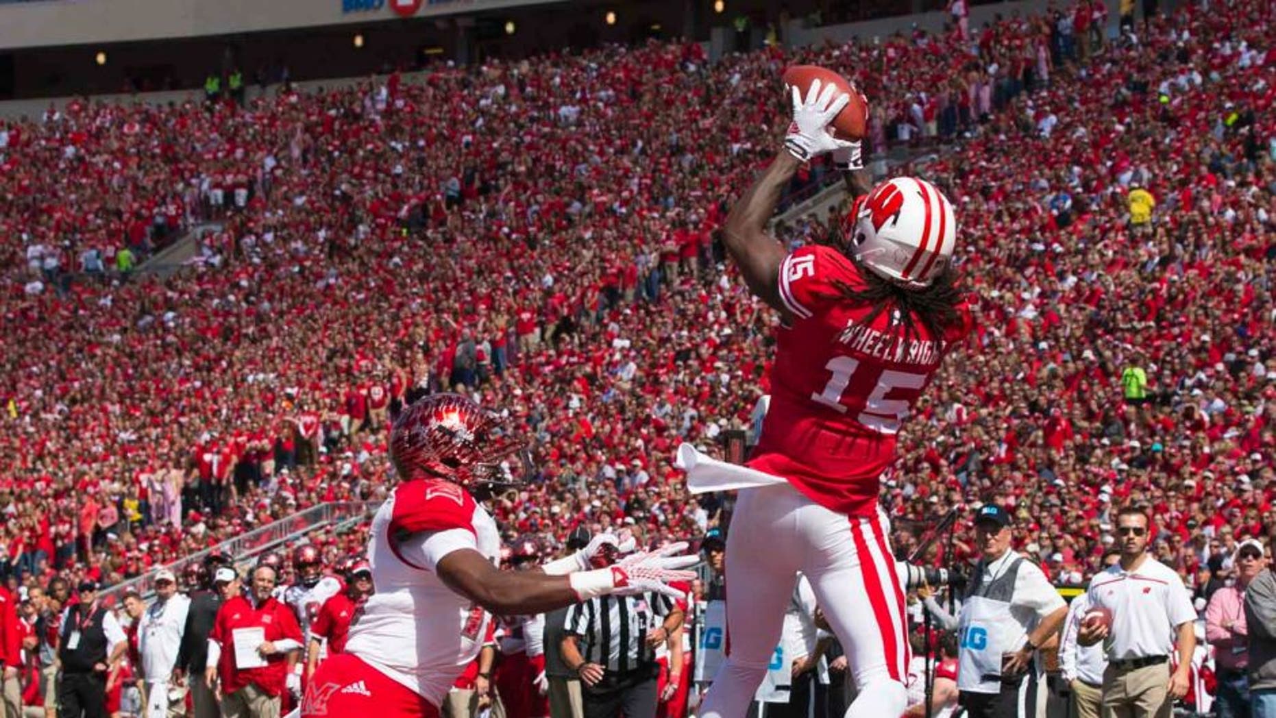 Wisconsin Badgers wide receiver Robert Wheelwright catches a touchdown pass during the second quarter against the Miami (Ohio) RedHawks at Camp Randall Stadium in Madison, Wis., on Saturday, Sept. 12, 2015.