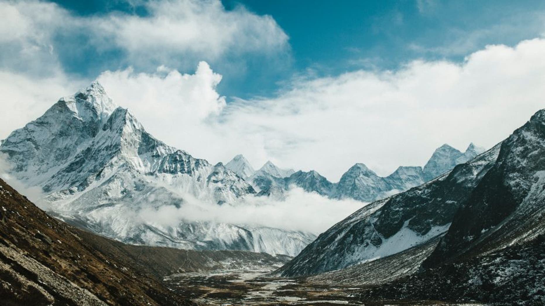 PHERICHE, NEPAL, FEBRUARY 13, 2015: The peak of Ama Dablam (6812m) is seen above the village of Pheriche and the Dudh Kosi river vallery, in the Solu-Khumbu region of Nepal, February 13, 2015. The Solu-Khumbu region is home to the world's highest mountain, Mount Everest (8848m). According to leading researchers, in recent years the landscape and people of the Solu-Khumbu region have come under increasing pressure from raising temperatures and shifting climactic conditions. As well as being home to many of the world's highest mountains, the region holds some of the world's largest and highest glaciers, some of which have begun to show signs of increased and rapid melt. The Khumbu glacier, which lies at the foot of Mount Everest, has in the last decade begun to develop ponds of water on its surface, which scientists say could develop into a much larger lake on the glacierâs surface if warming trends continue. Recent research indicates that annual mean surface temperature in the Himalaya has increased by 1.5 degrees celsius over pre-industrial temperatures. (Photo by Ed Giles/Getty Images).