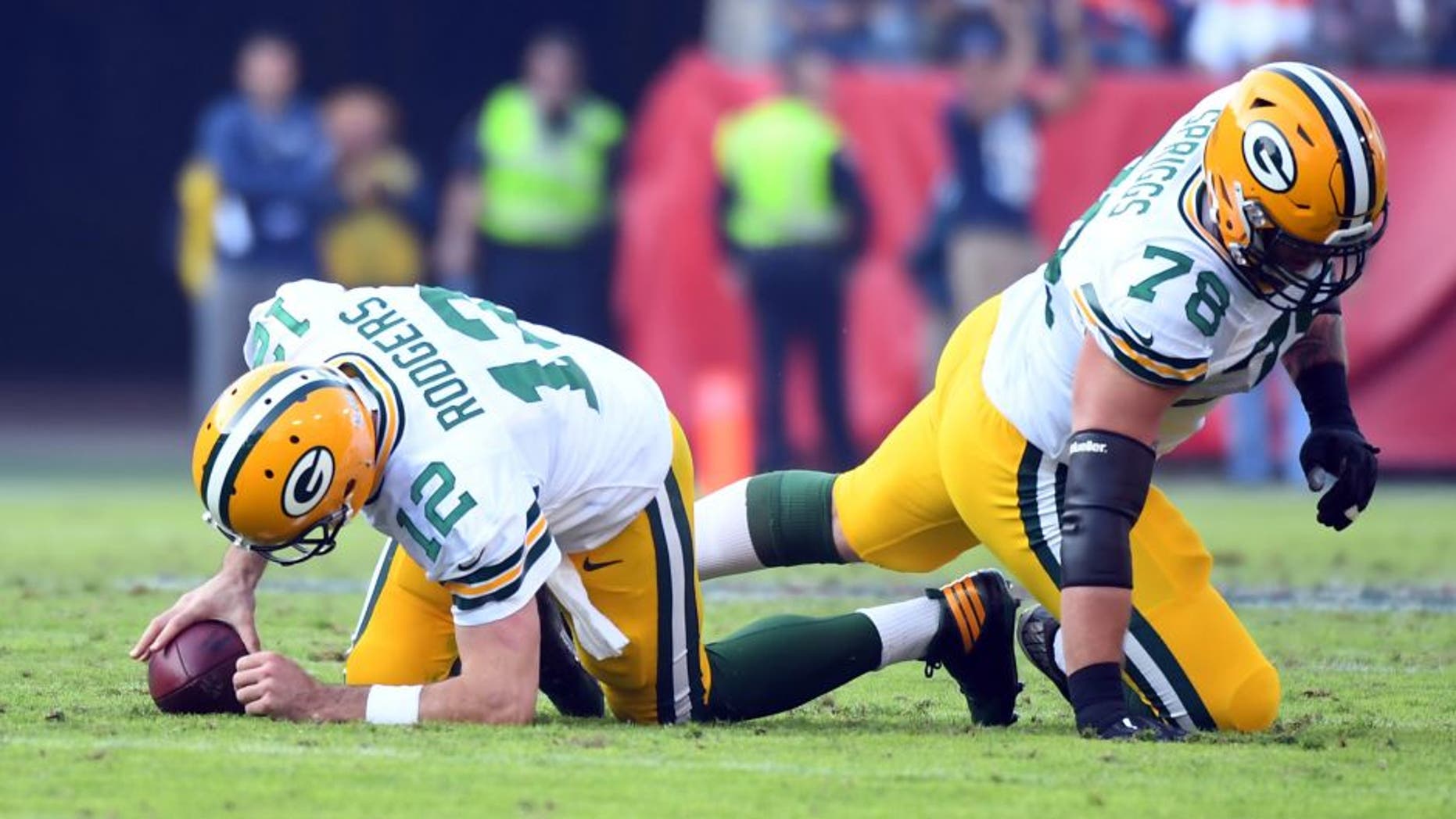 Nov 13, 2016; Nashville, TN, USA; Green Bay Packers quarterback Aaron Rodgers (12) and tackle Jason Spriggs (78) react after a sack during the second half against the Tennessee Titans at Nissan Stadium. The Titans won 47-25. Mandatory Credit: Christopher Hanewinckel-USA TODAY Sports
