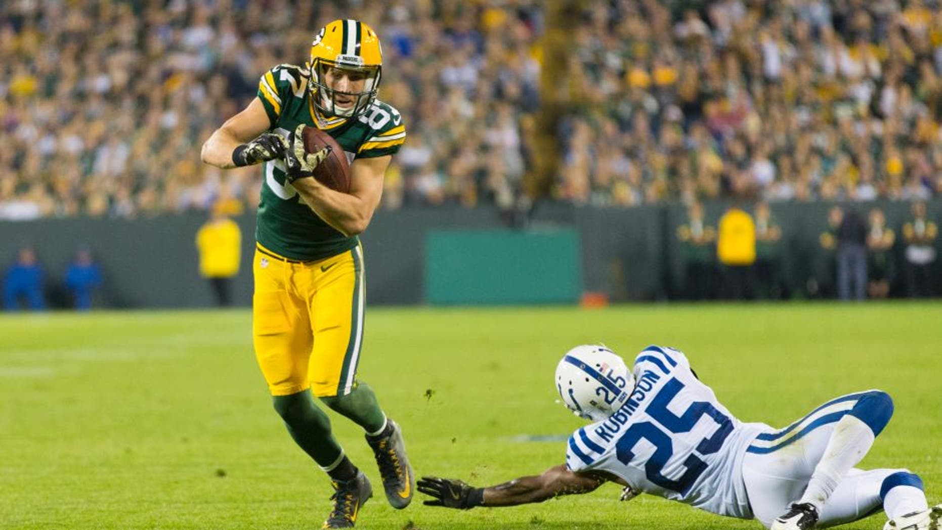 Nov 6, 2016; Green Bay, WI, USA; Green Bay Packers wide receiver Jordy Nelson (87) avoids Indianapolis Colts cornerback Patrick Robinson (25) after catching a pass during the fourth quarter at Lambeau Field. Indianapolis won 31-26. Mandatory Credit: Jeff Hanisch-USA TODAY Sports