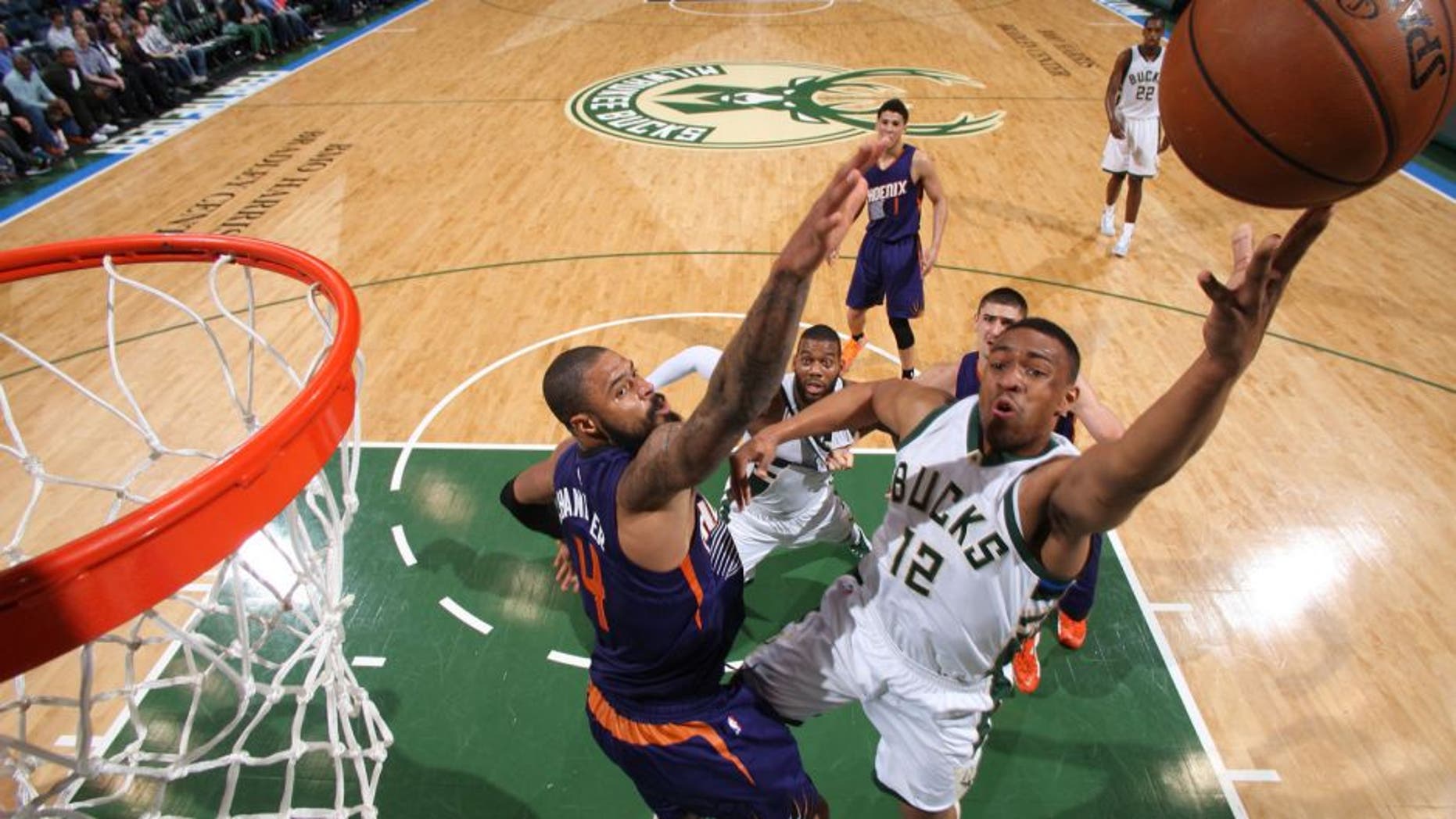 Jabari Parker of the Milwaukee Bucks shoots the ball Phoenix Suns.