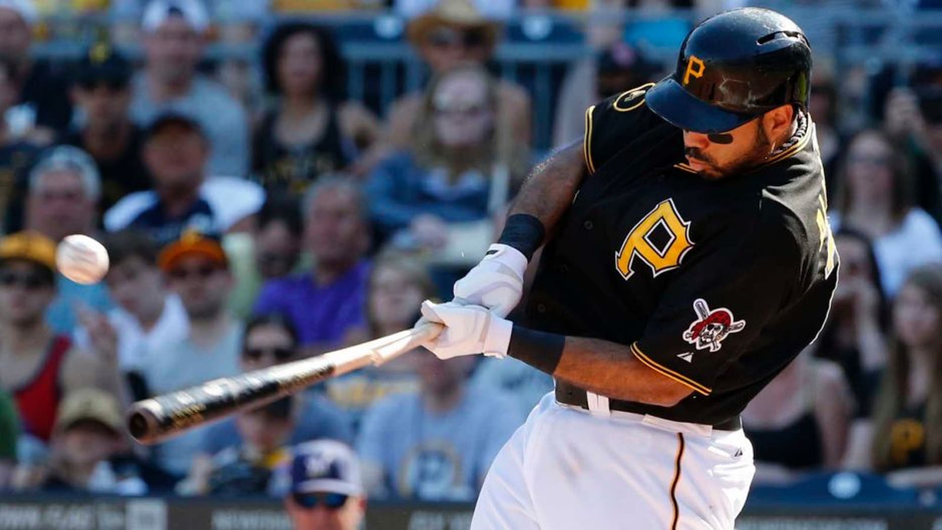 Saturday, June 7: The Pittsburgh Pirates' Pedro Alvarez drives in a run with a broken-bat single off Milwaukee Brewers starting pitcher Matt Garza during the third inning.